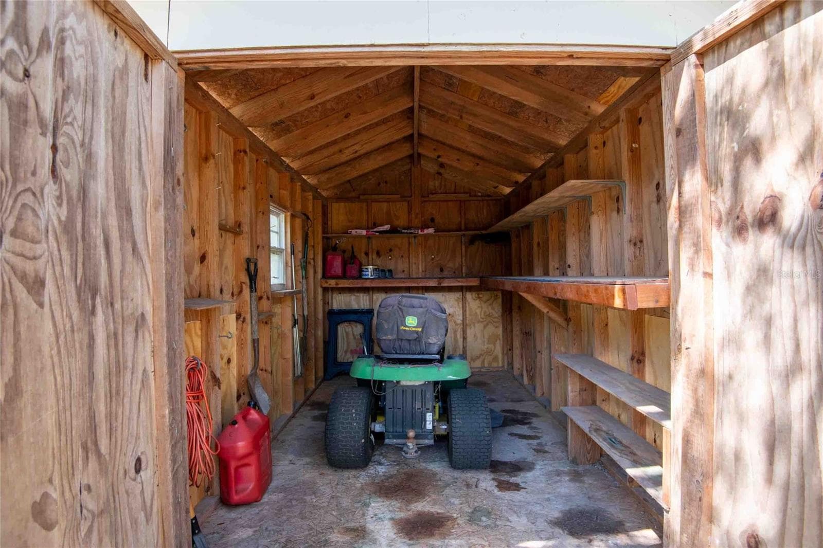 Storage for lawn equipment. - 14221 HURRICANE DR, WEEKI WACHEE