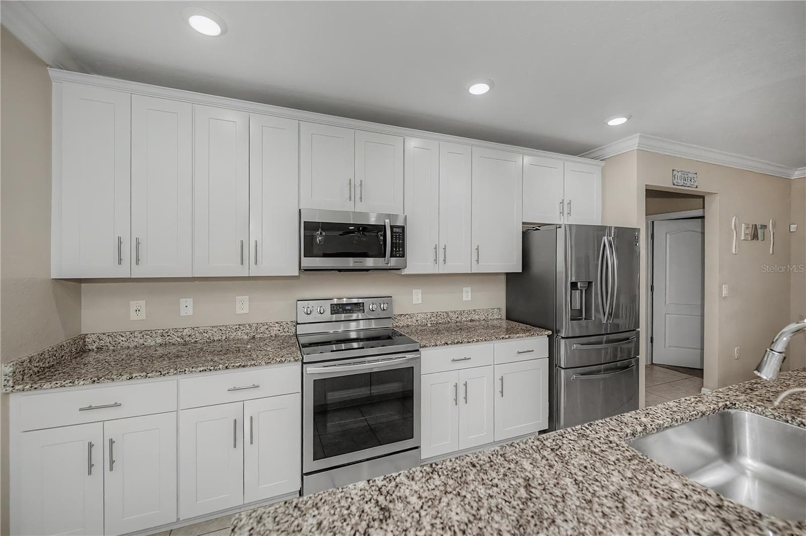 Chef's Kitchen with Granite Countertops, Stainless Steel Appliances & Abundant Cabinetry. - 640 ENCARNACION ST, PUNTA GORDA