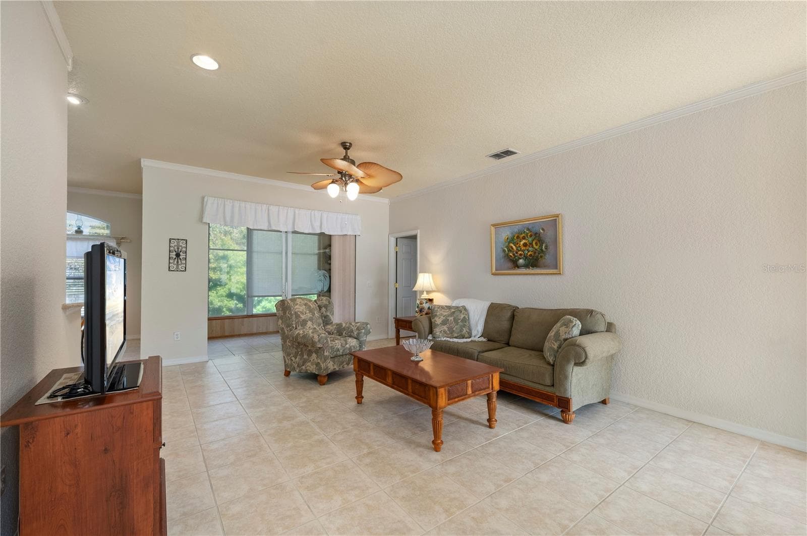 Living Room, tiled floors, crown molding - 1637 PALACE CT, PORT CHARLOTTE