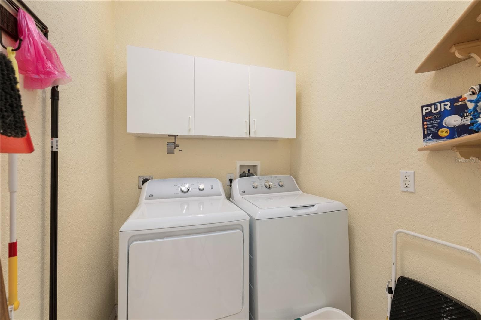 Laundry room has newer washer/dryer, cabinets & shelving - 1637 PALACE CT, PORT CHARLOTTE
