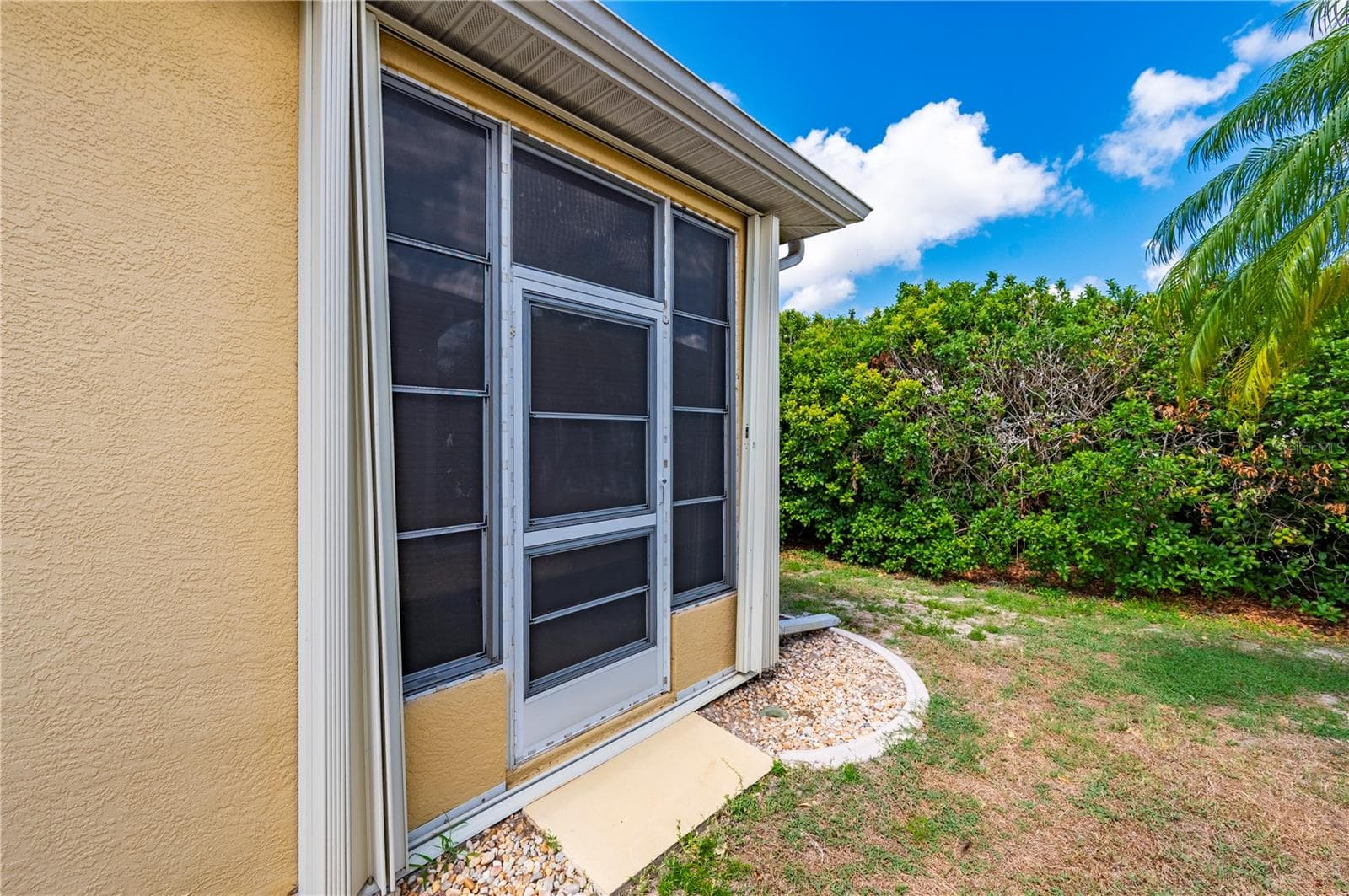 Accordian storm shutters on lanai, too! - 1637 PALACE CT, PORT CHARLOTTE