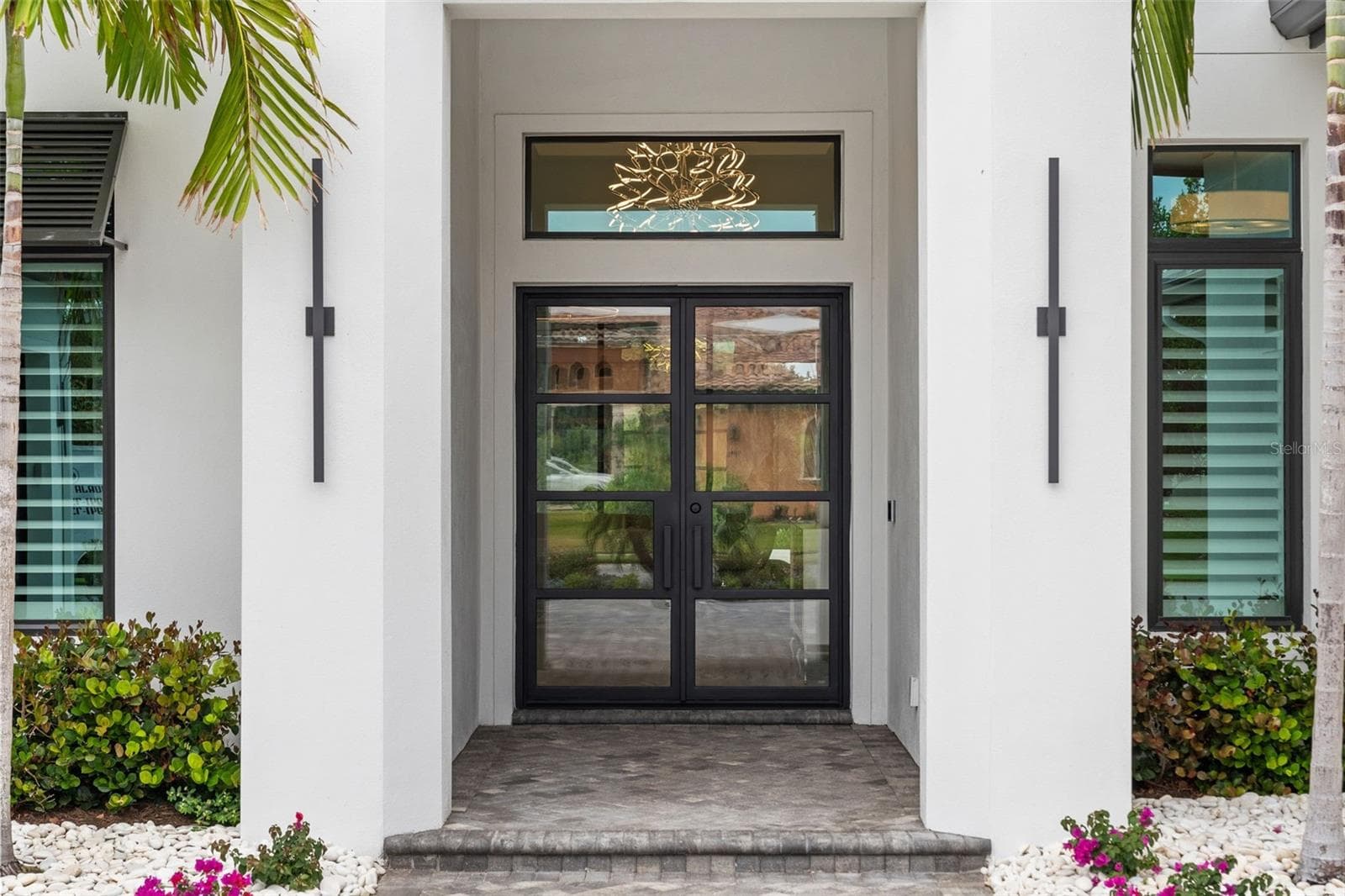 It is perfectly positioned on over a half-acre homesite with tropical preserve views and accompanied by a deeded private boat dock! - 11721 RIVE ISLE RUN, PARRISH
