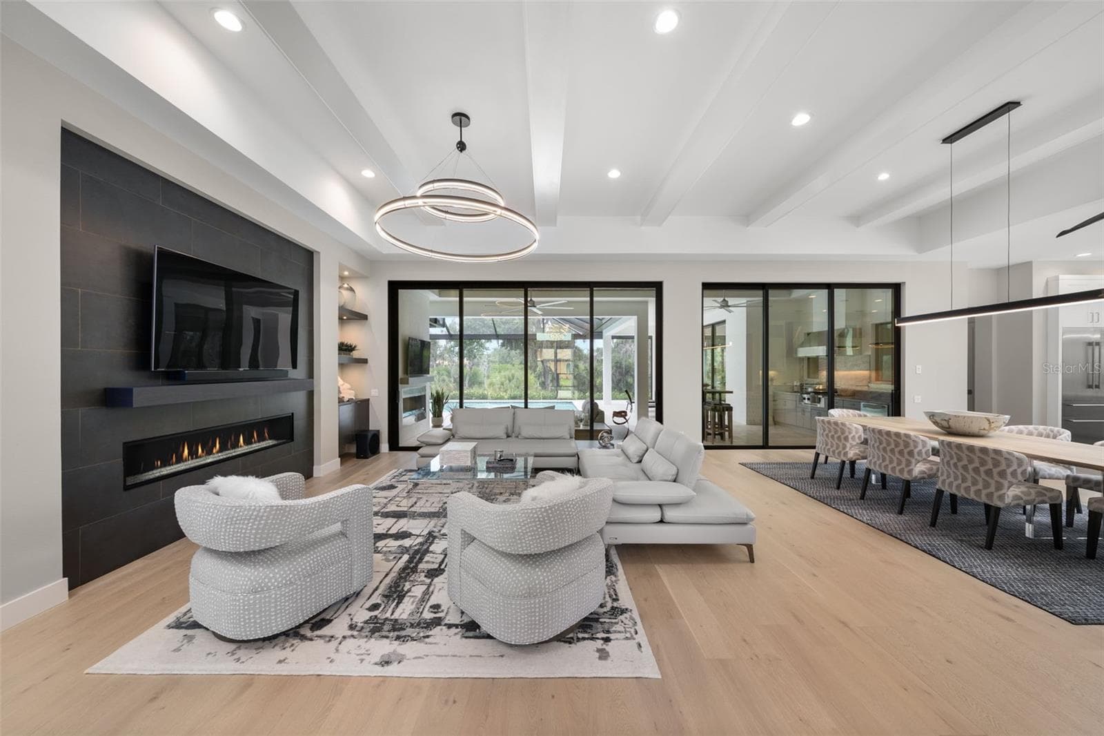 The expansive great room serves as a stunning focal point for the home with soaring 13-foot ceilings. - 11721 RIVE ISLE RUN, PARRISH