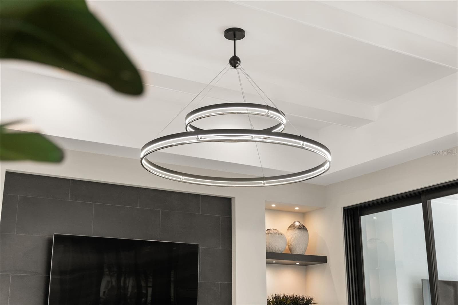 The great room has a beautiful Grande Illusion LED Ring Chandelier. - 11721 RIVE ISLE RUN, PARRISH