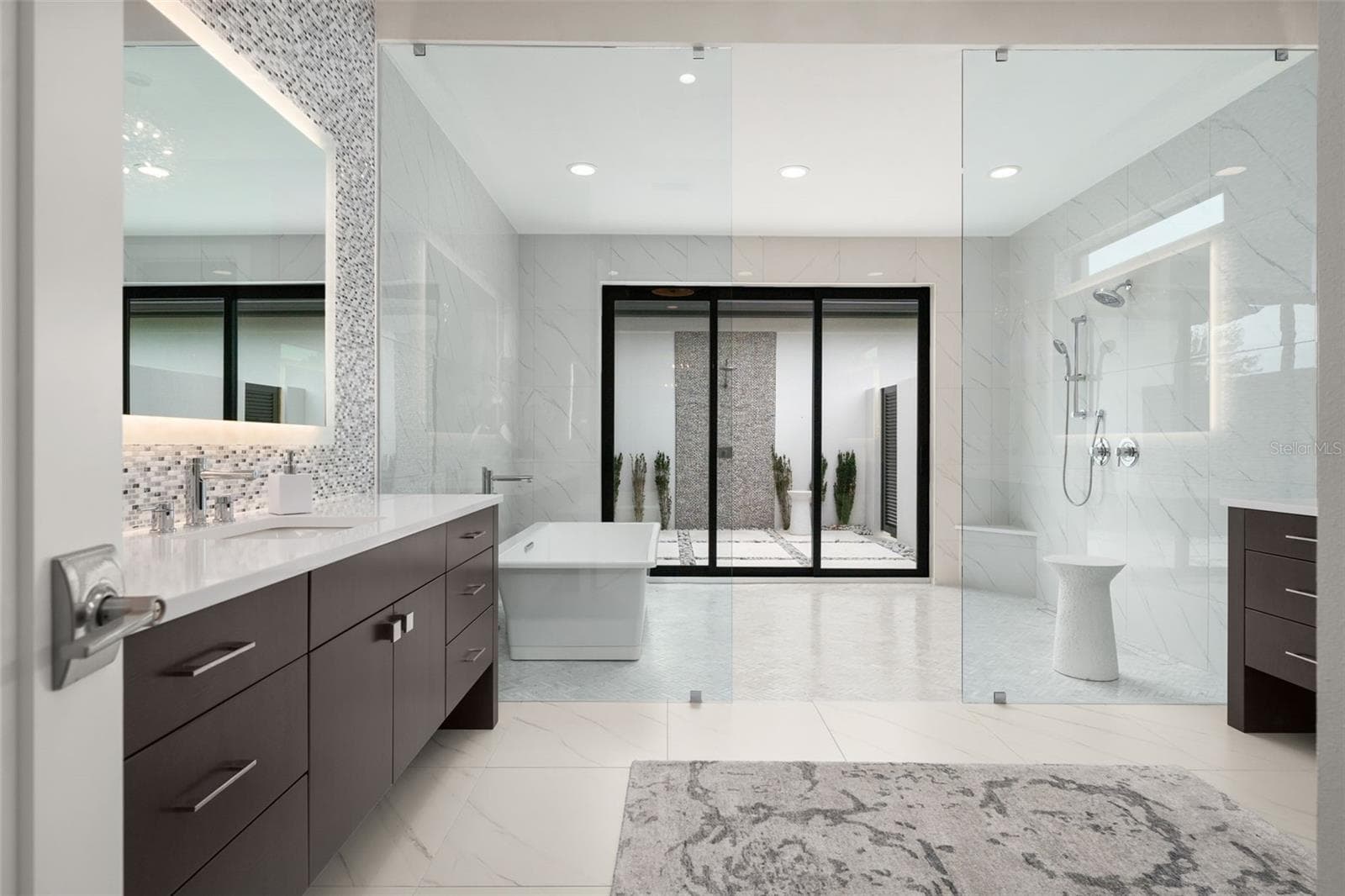 The spa-inspired primary bathroom is a true retreat! - 11721 RIVE ISLE RUN, PARRISH