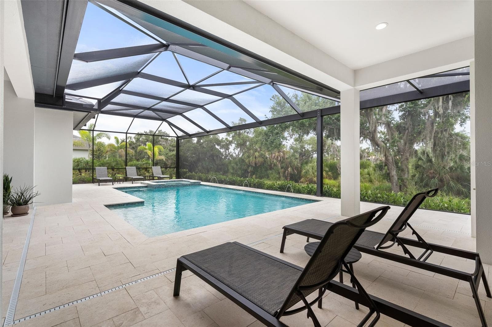 There are lots of different spaces around the pool for gathering spaces. - 11721 RIVE ISLE RUN, PARRISH