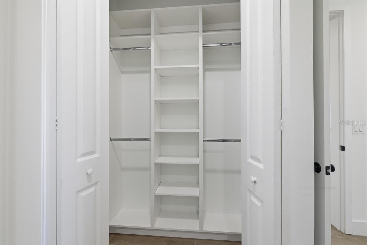 primary bedroom walk in closet - 500 SUNSET RD N, ROTONDA WEST