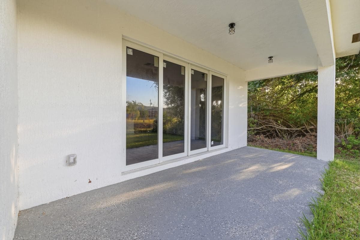 large outdoor lanai - 500 SUNSET RD N, ROTONDA WEST