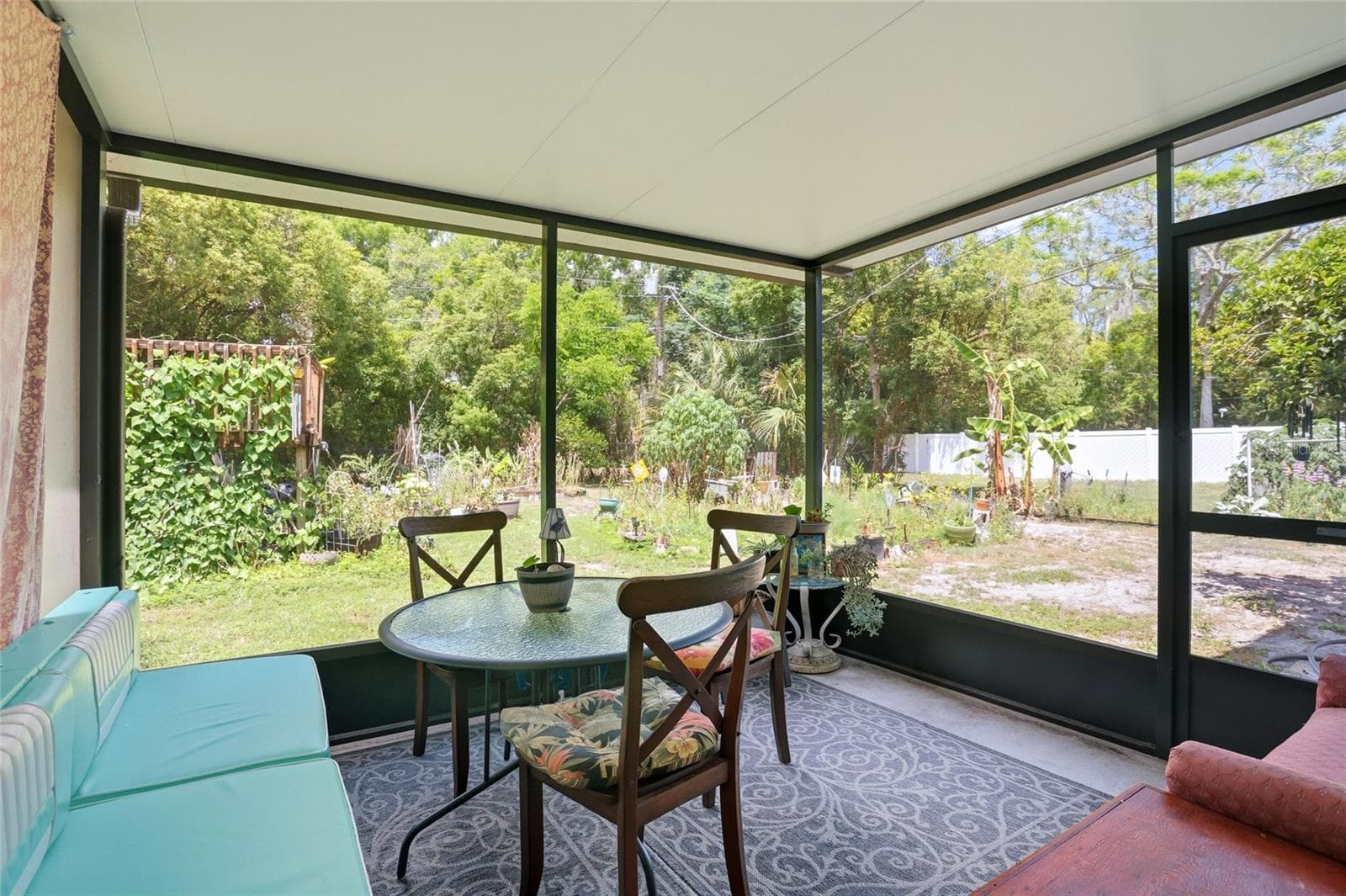 large screen porch to enjoy the butterfly garden and Florida sunshine - 804 ROSALIA DR, SANFORD