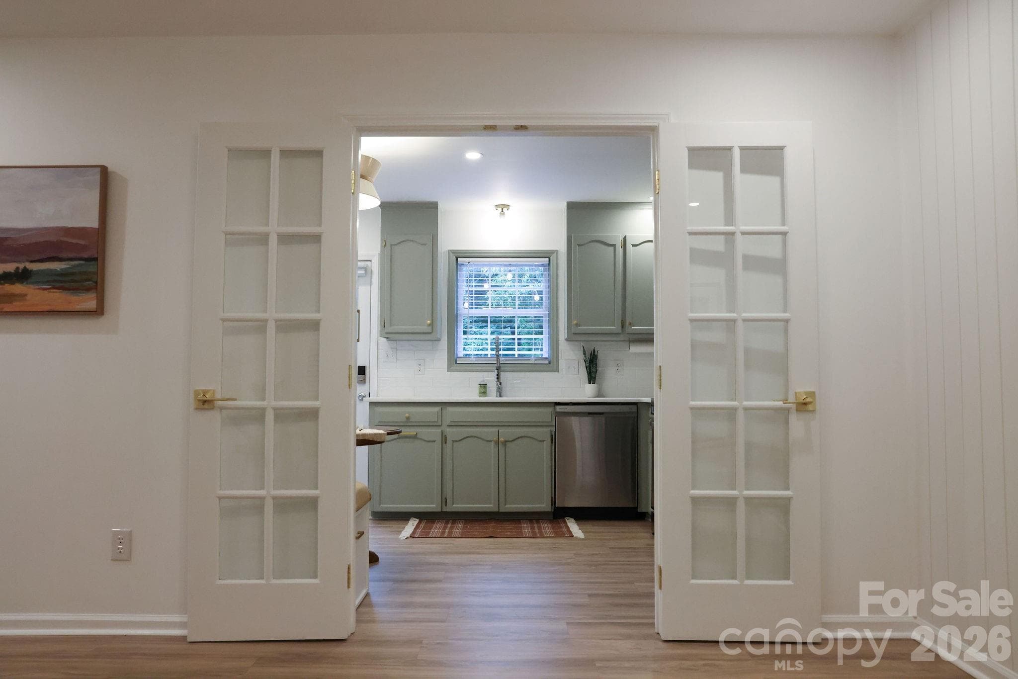 French doors allow open flow to the kitchen or separation when needed - Belmont