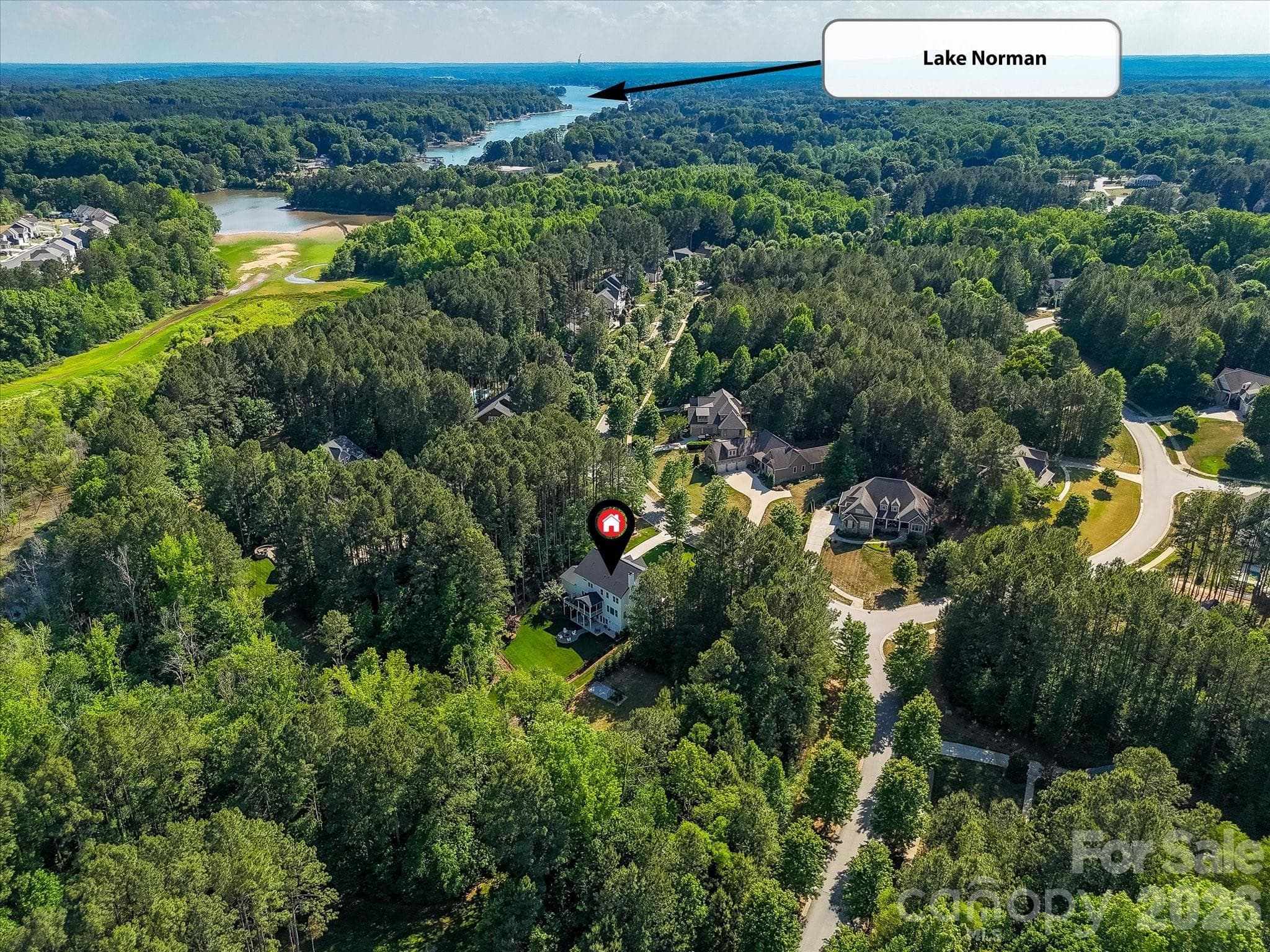 Enjoy a peaceful wooded setting in a coveted neighborhood, just moments from Lake Norman, offering the perfect blend of privacy, natural beauty, and convenient access to waterfront recreation. - Troutman