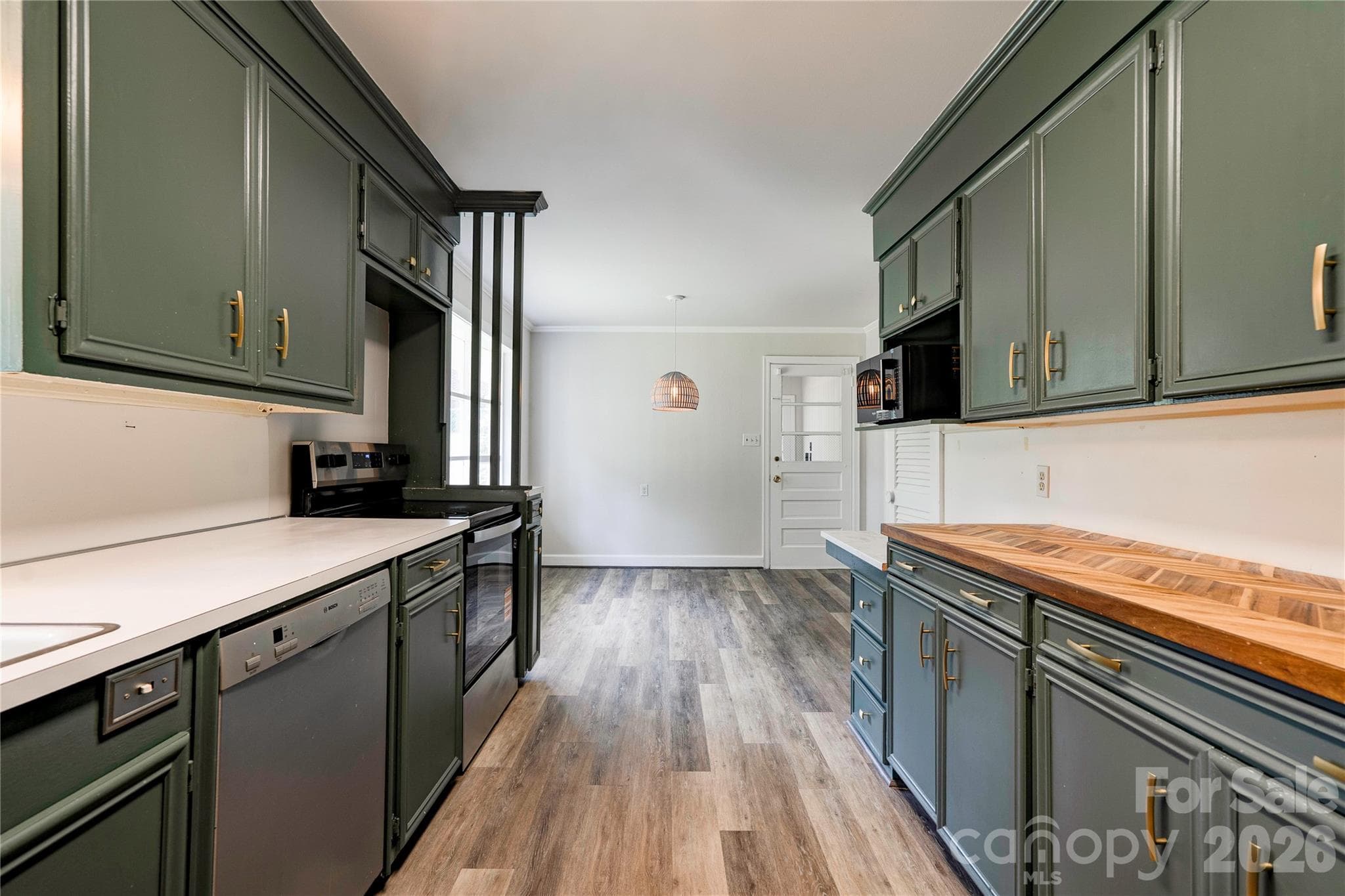 Kitchen offer new range and microwave and fixtures. Tons of cabinets and storage. - Shelby