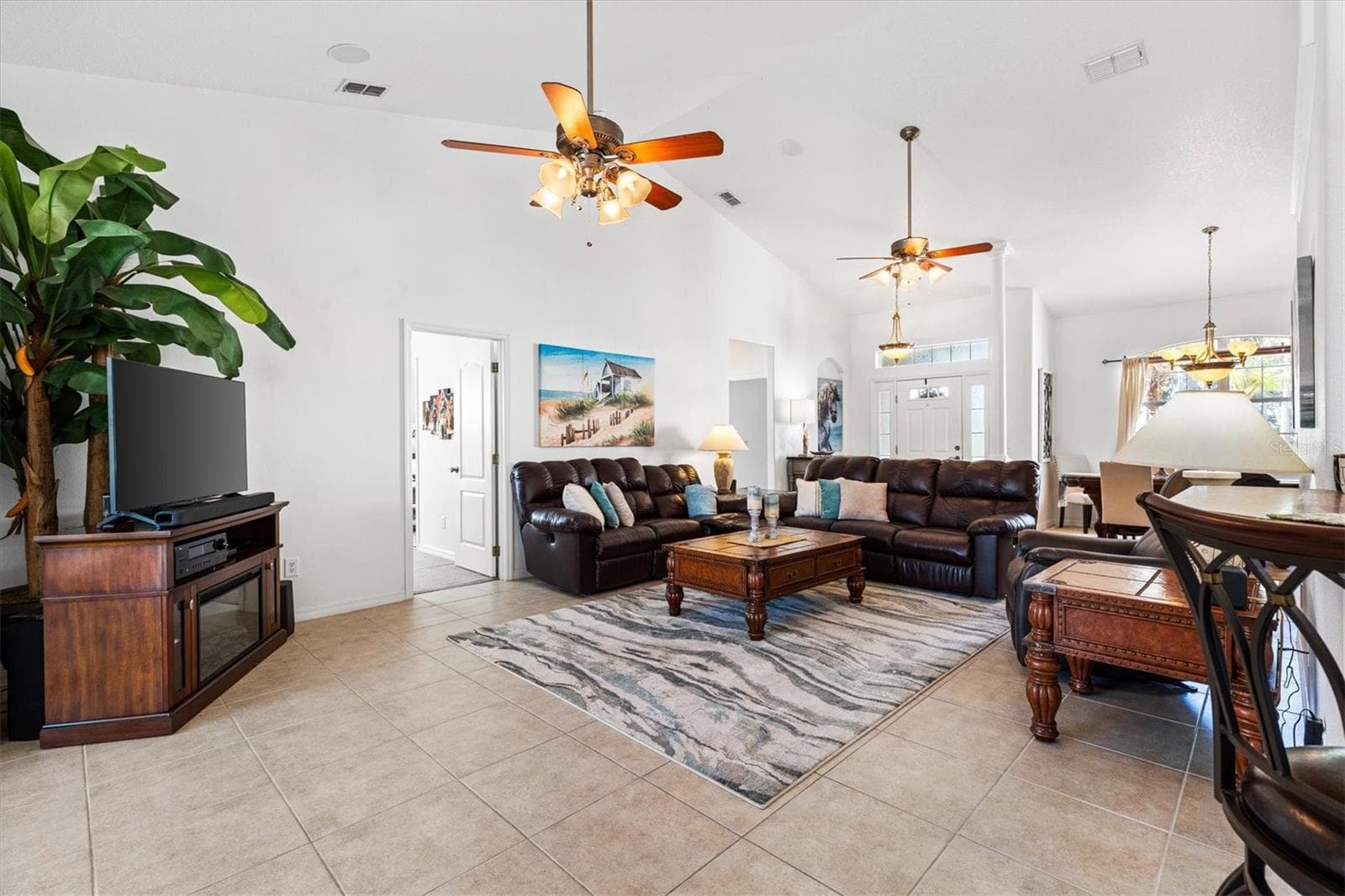 Inviting entertaining space perfect for watching the game or your favorite movie after a relaxing day on the water. - 12107 EAGLE POINT CT, LEESBURG