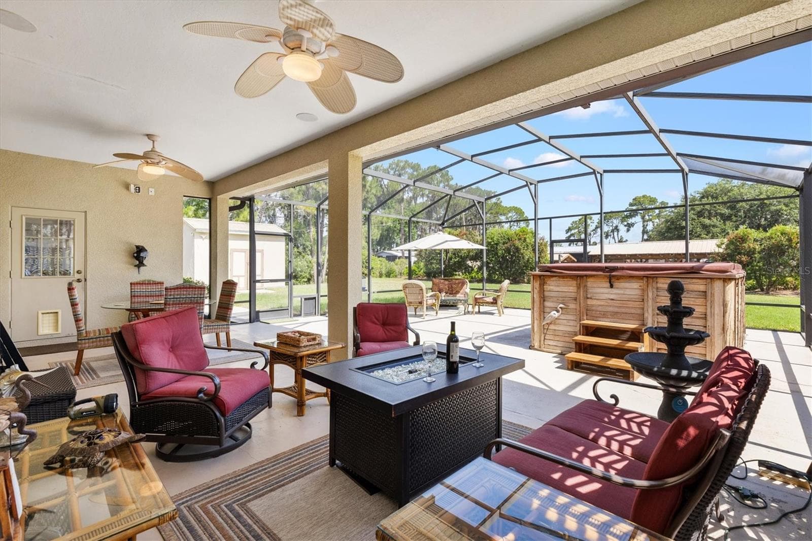 The partially covered outdoor space adds incredible versatility, creating the perfect setting for entertaining, relaxing, or enjoying the spa and wellness area year-round. - 12107 EAGLE POINT CT, LEESBURG