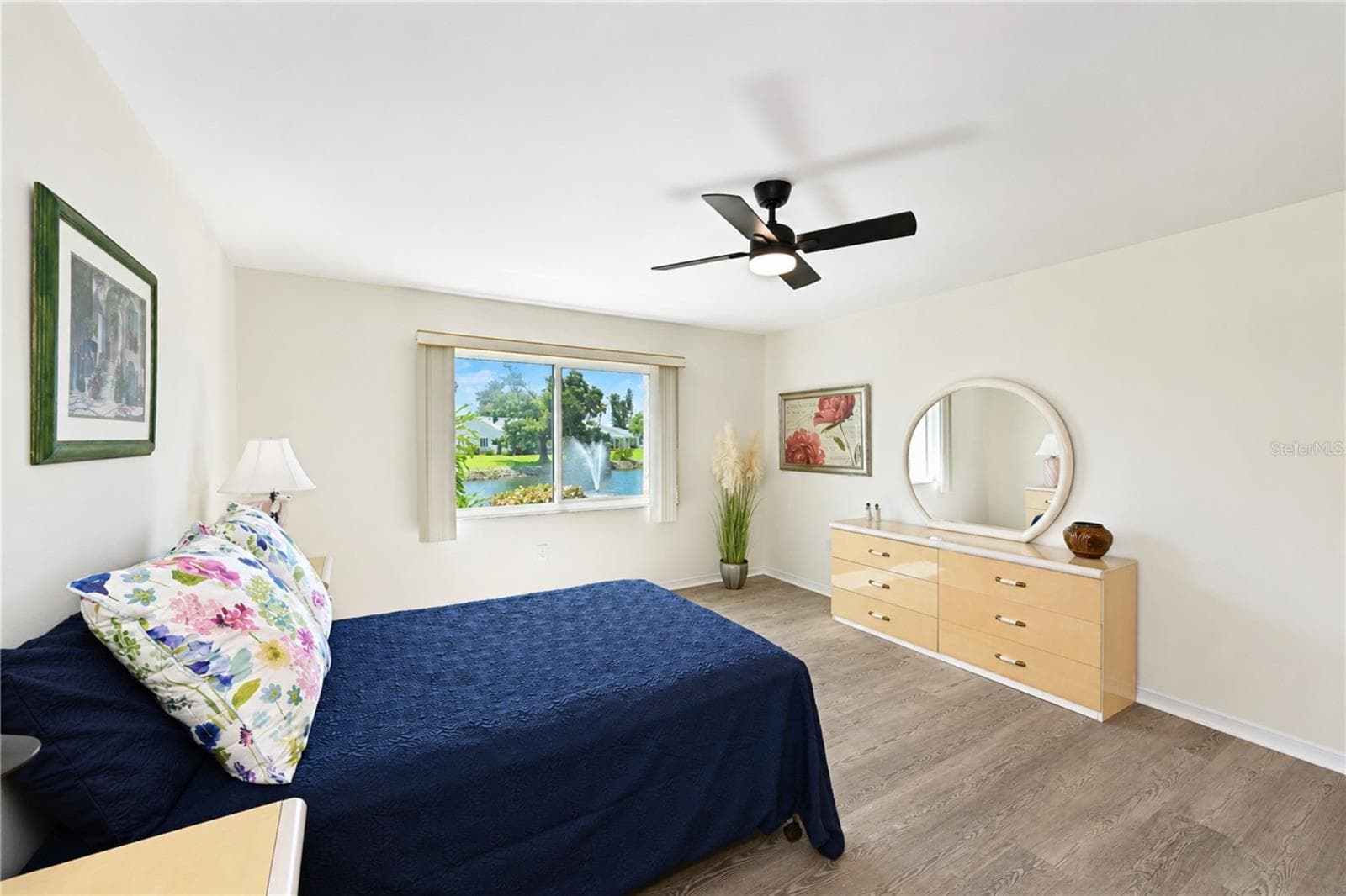 Primary bedroom enjoys water views - 4853 INDEPENDENCE DR, BRADENTON