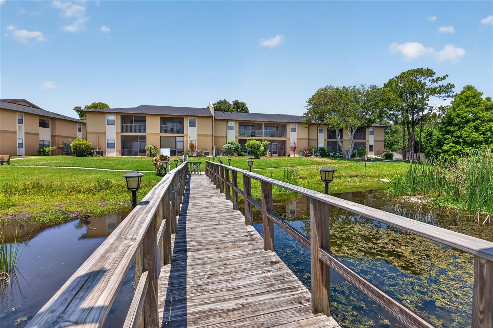 View of the first floor unit from the dock. - 10125 SAILWINDS BLVD N #104, LARGO