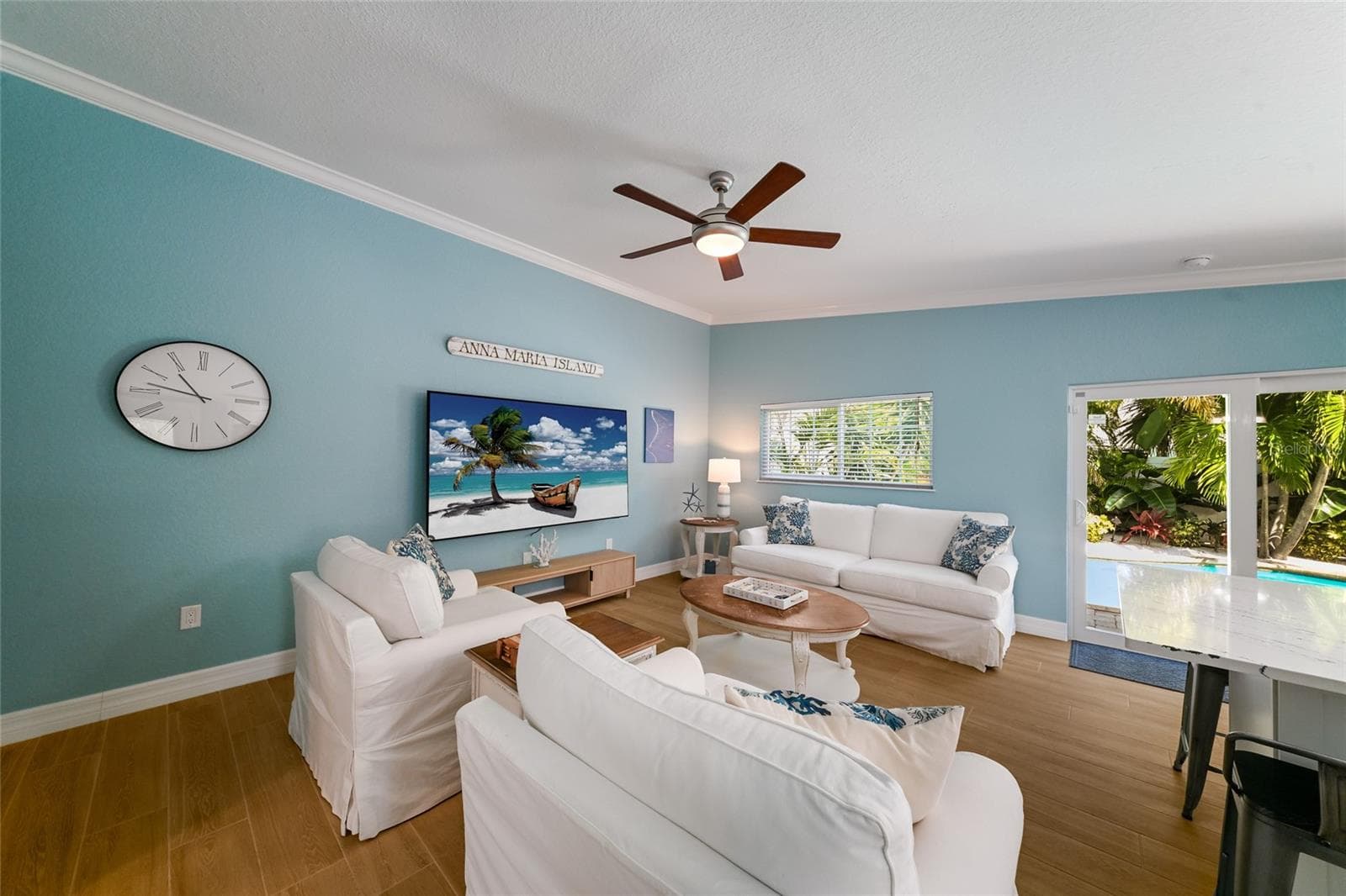 Impact sliding doors in the living room to the pool area - 324 64TH ST, HOLMES BEACH