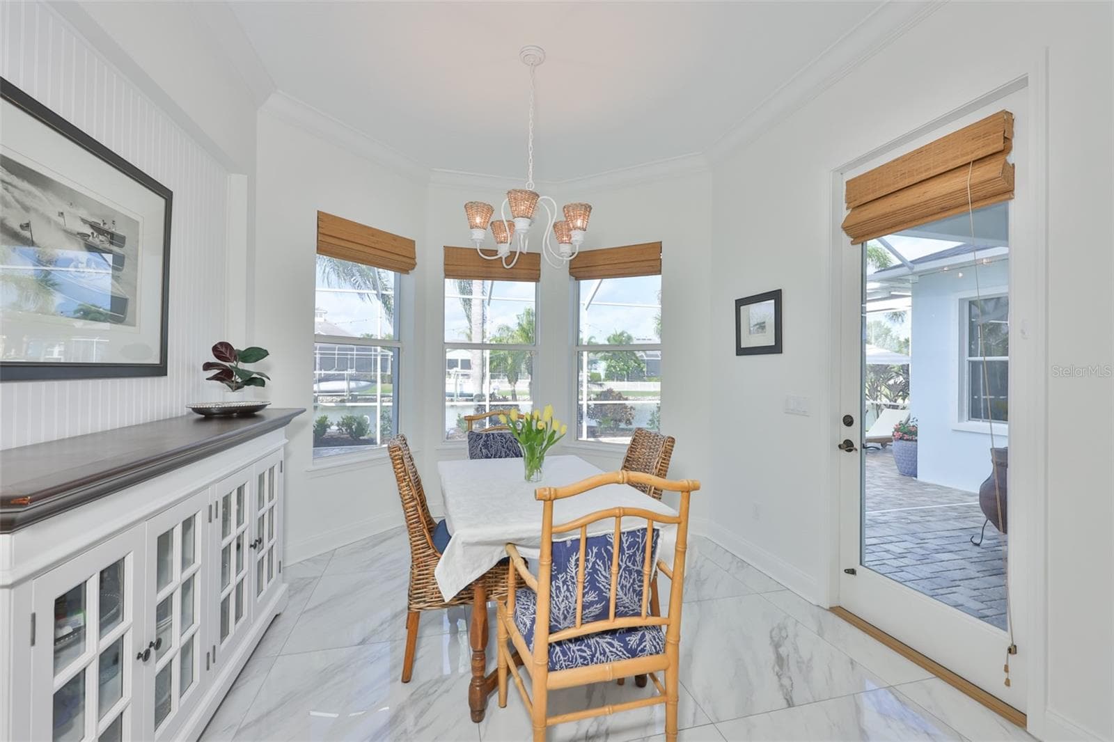 breakfast room/nook with view of backyard and canal - 5318 LOON NEST CT, APOLLO BEACH