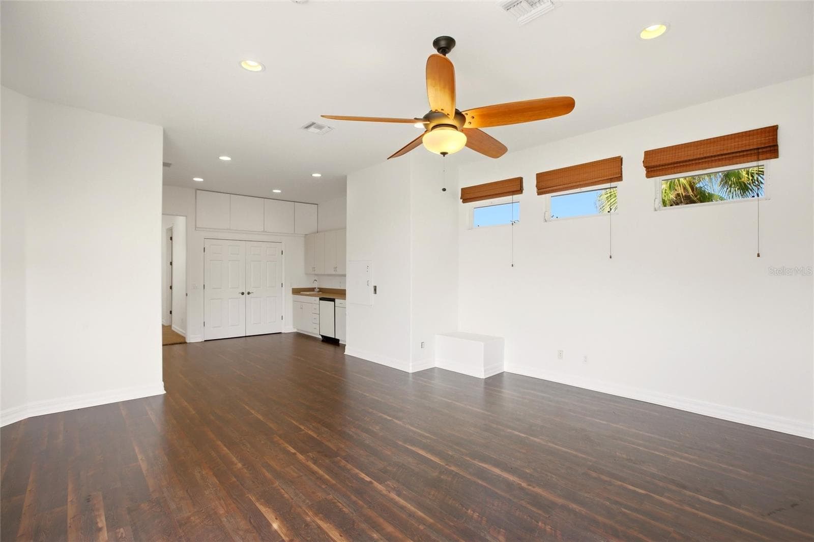 The spacious bonus room offers exceptional versatility, serving as an ideal playroom, guest quarters, media room, or workout space. It is well-appointed with a wet bar, refrigerator, washer and dryer, and a large storage closet, and opens through sliding glass doors to a private second-floor balcony overlooking the lake and golf course. A dumbwaiter provides convenient access from the kitchen below. - 8417 LONE EAGLE WAY, SARASOTA
