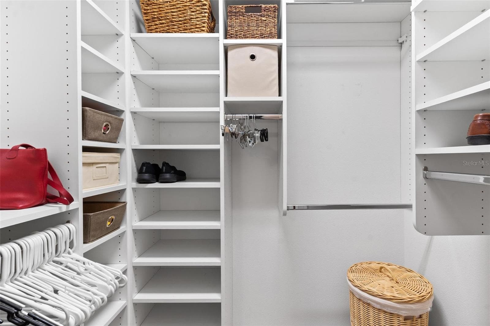 Custom walk-in closet in Primary Bedroom. - 6115 LANDINGS BLVD, LADY LAKE