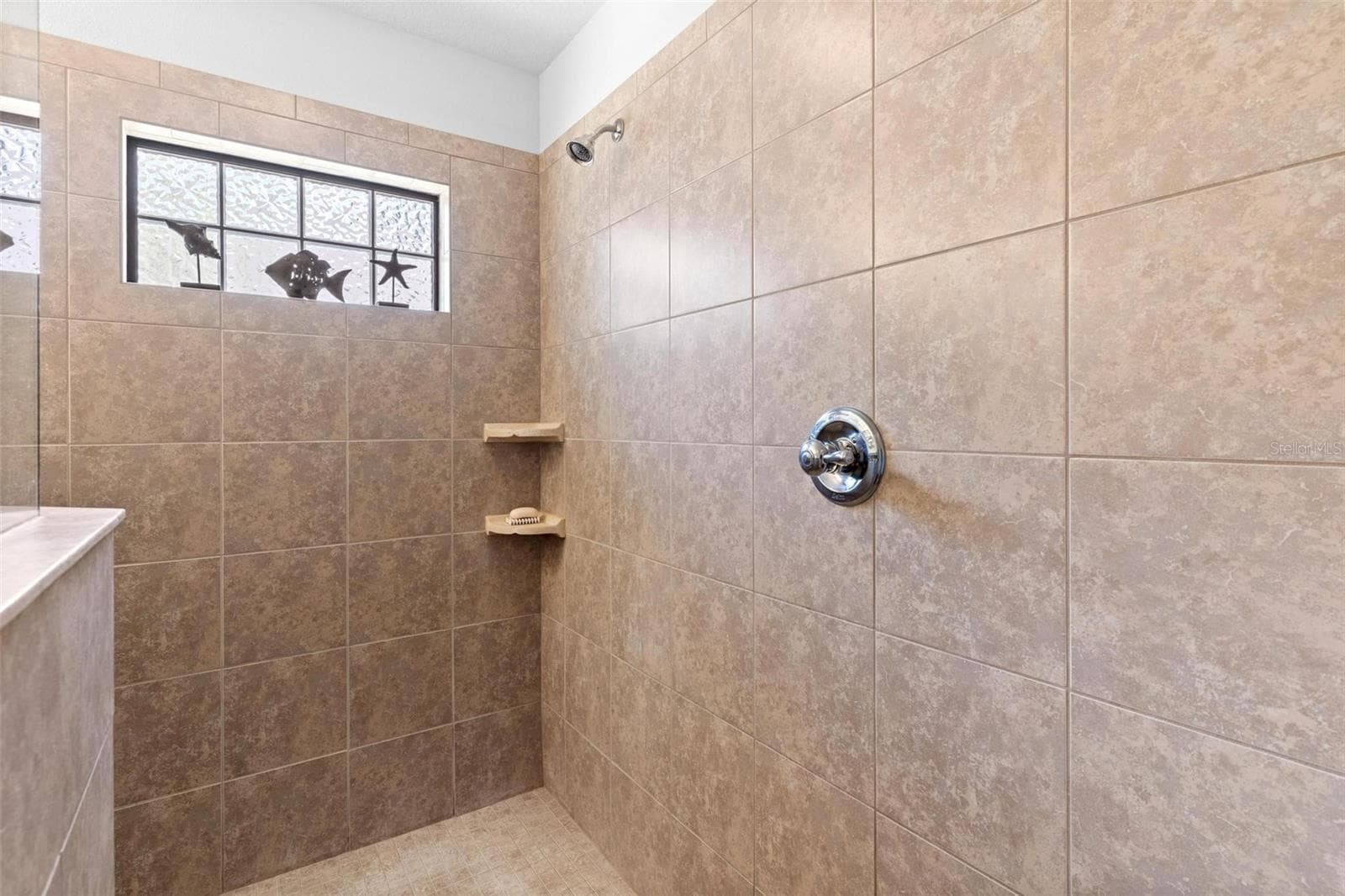 Huge primary walk-in shower. - 6115 LANDINGS BLVD, LADY LAKE