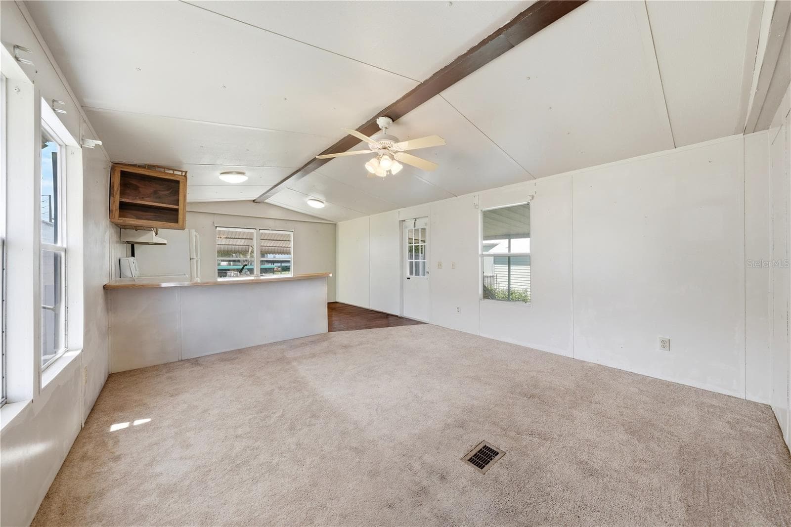 Living room with counter seating at Kitchen counter - 30107 GREEN BAY DR, TAVARES