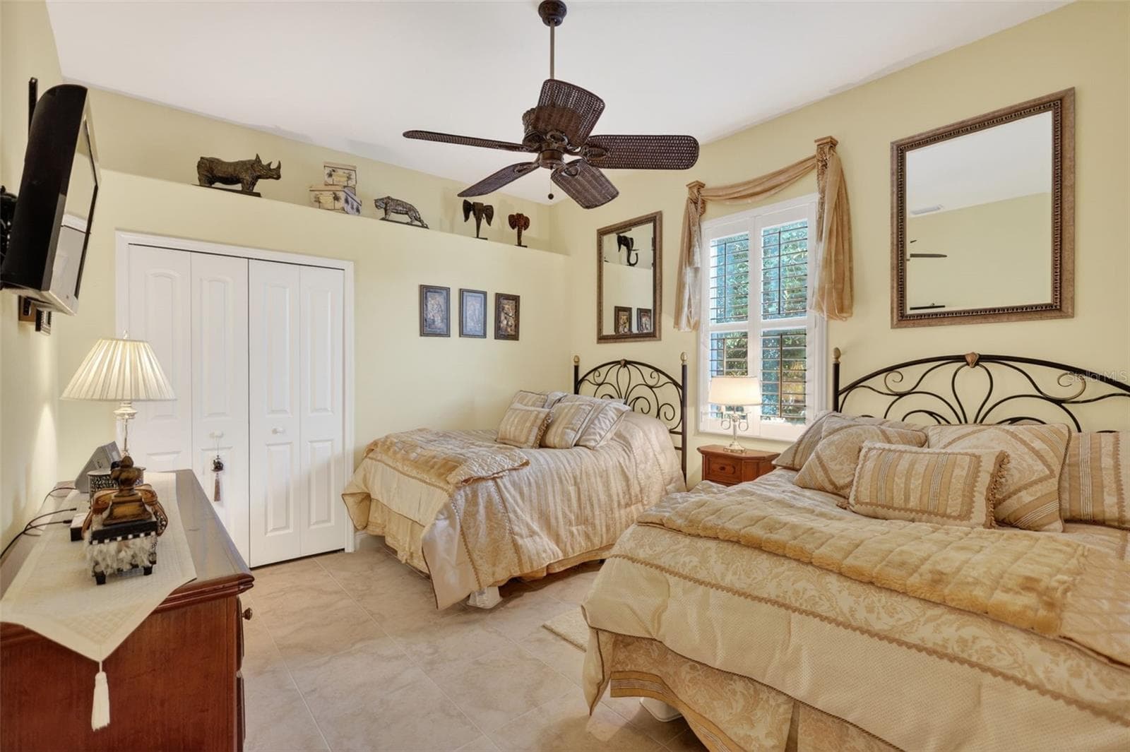Designed for both comfort and functionality, this secondary bedroom features abundant natural light and ample space for family or visiting guests - 1210 408TH CT E, MYAKKA CITY