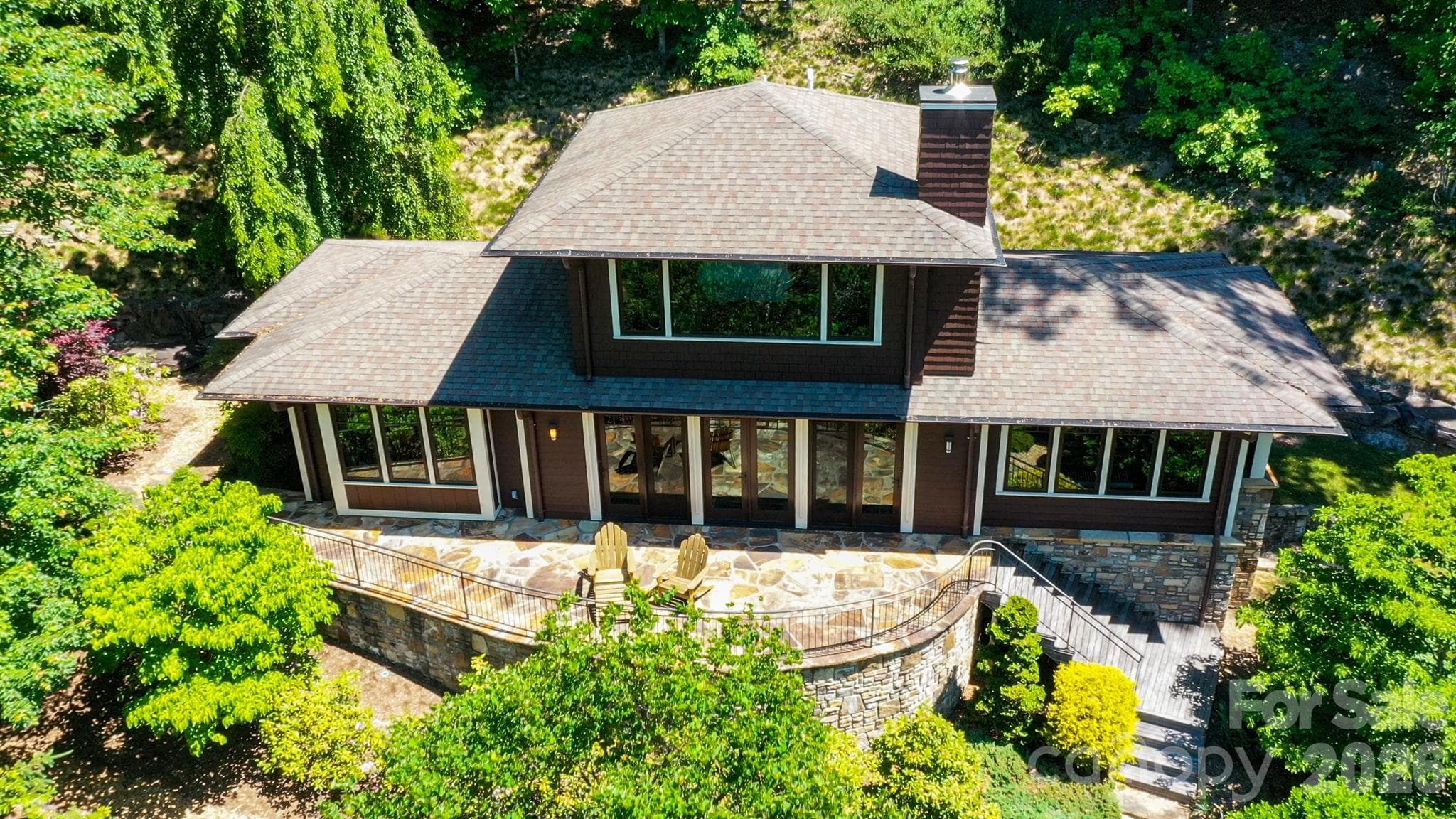 Guest House. Separate guest house privately nestled among the trees with stunning stonework, expansive windows, and an inviting outdoor living space. - 29 Gardner Drive, Asheville