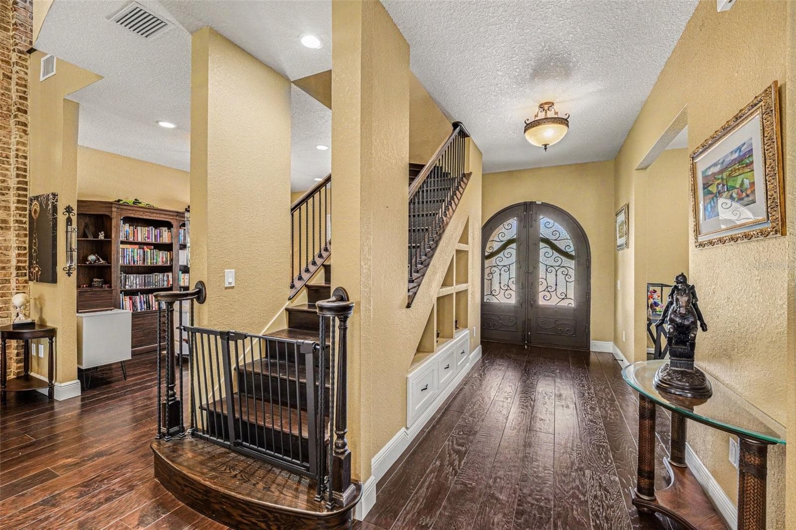 facing front entrance inside, stairway to loft - 2179 ARNOLD PALMER DR, TITUSVILLE
