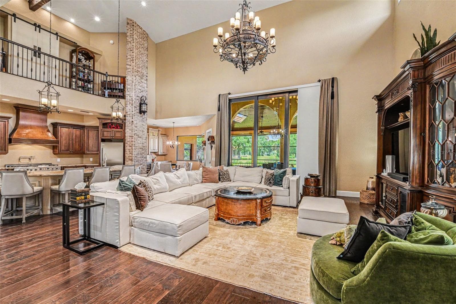 Great room, triple sliders lead to first level outside screened lanai - 2179 ARNOLD PALMER DR, TITUSVILLE