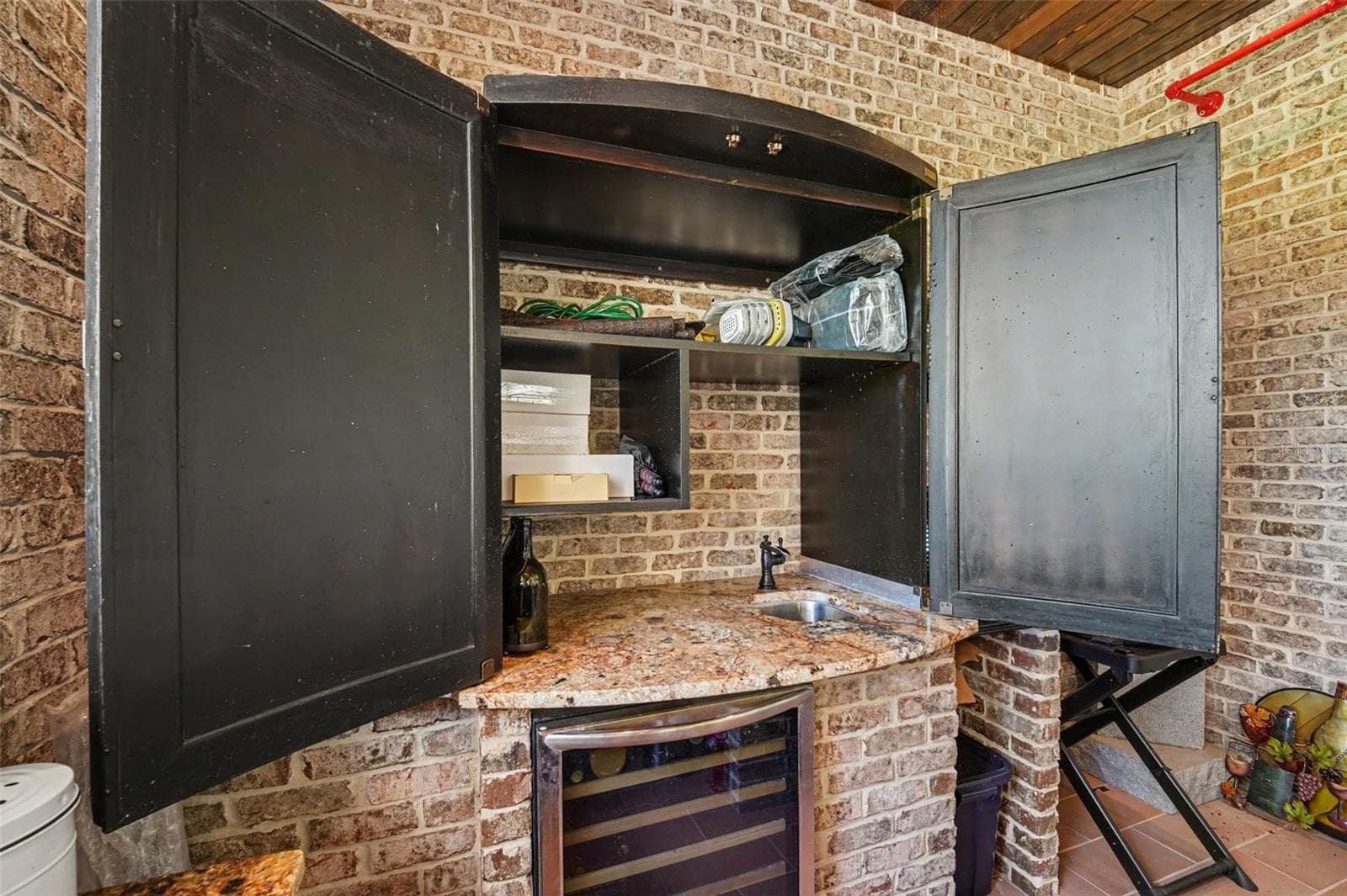outside bar with wine fridge - 2179 ARNOLD PALMER DR, TITUSVILLE