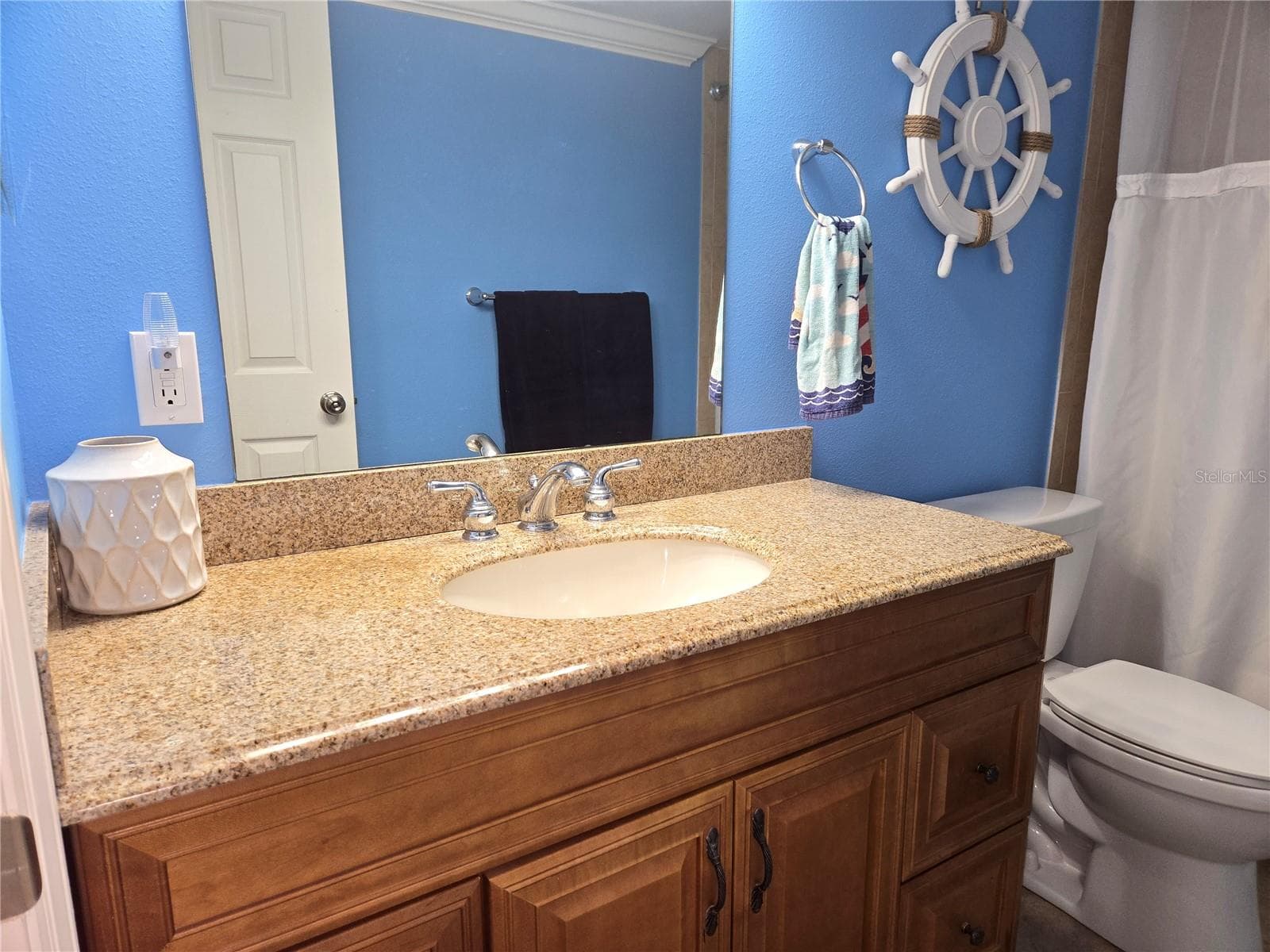 LOTS OF COUNTER SPACE ON THE VANITY - 5605 SHORE BLVD S #1B, GULFPORT