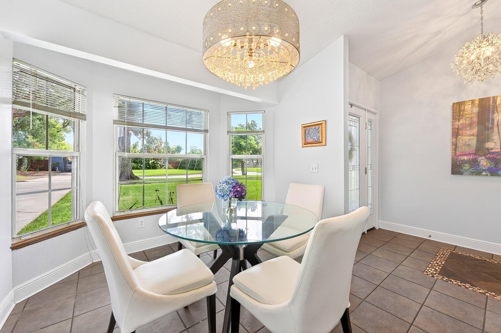 The formal Dining Room features a LOVELY BAY WINDOW overlooking the front yard, creating a bright and elegant setting for gatherings and special occasions. - 2706 HARGILL DR, ORLANDO