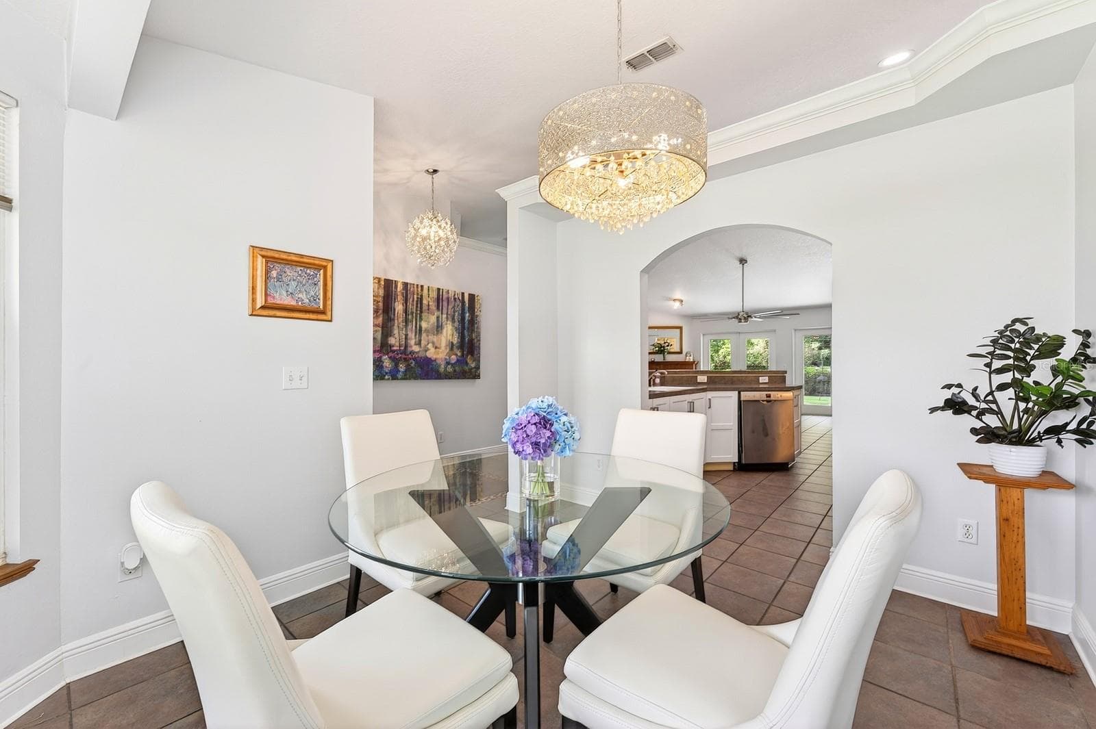 Beautiful ceramic tile flooring flows throughout the main living areas, while GRACEFUL ARCHITECTURAL DETAILS throughout the home add character and charm. - 2706 HARGILL DR, ORLANDO