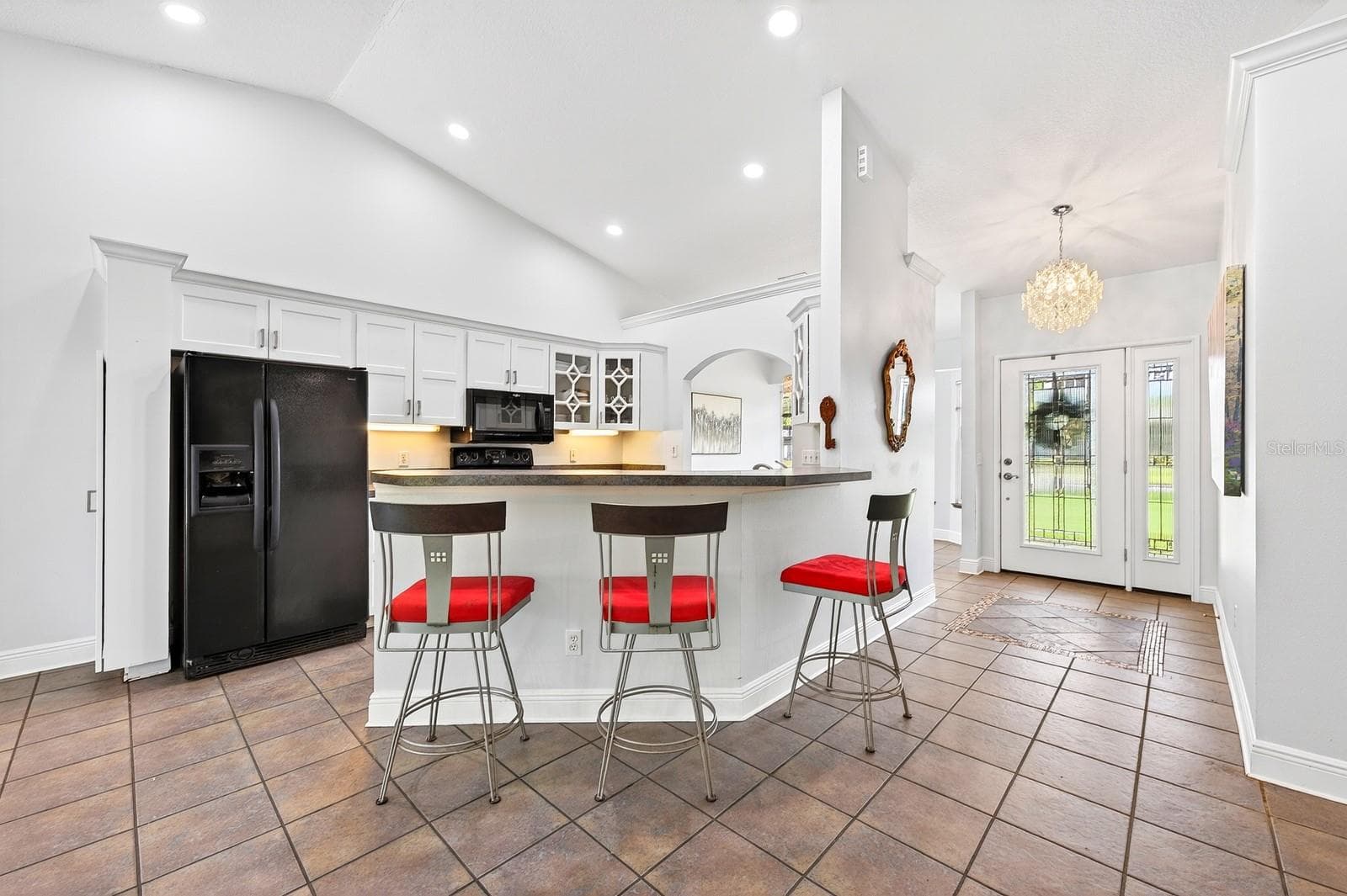 A BOSCH DISHWASHER (2021), breakfast bar seating, and a walk-in pantry offer both style and functionality to the Kitchen. - 2706 HARGILL DR, ORLANDO