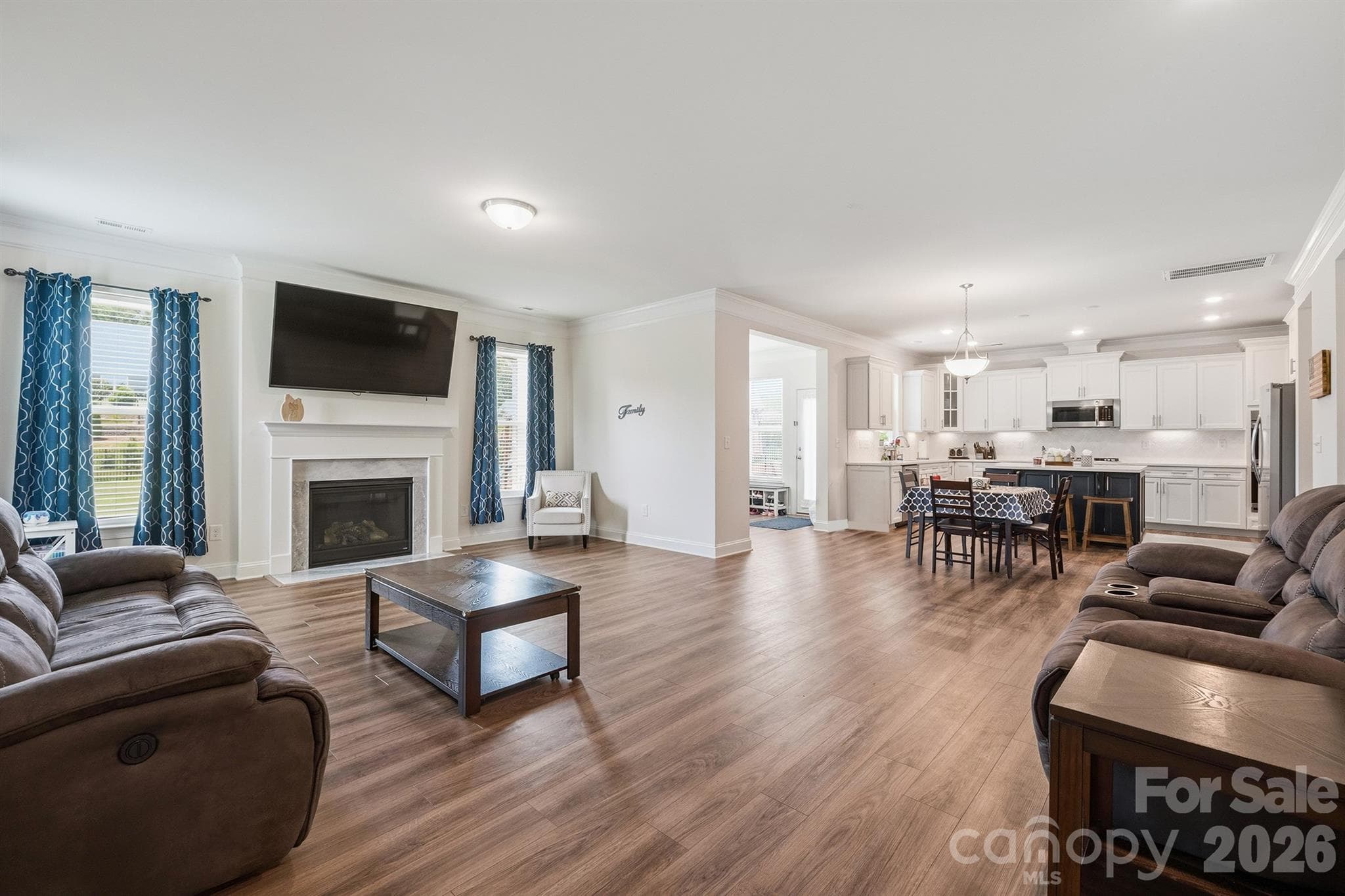 Open Floor Plan - Living Room with Gas Fireplace, Breakfast Nook, Kitchen, and Sunroom - Waxhaw