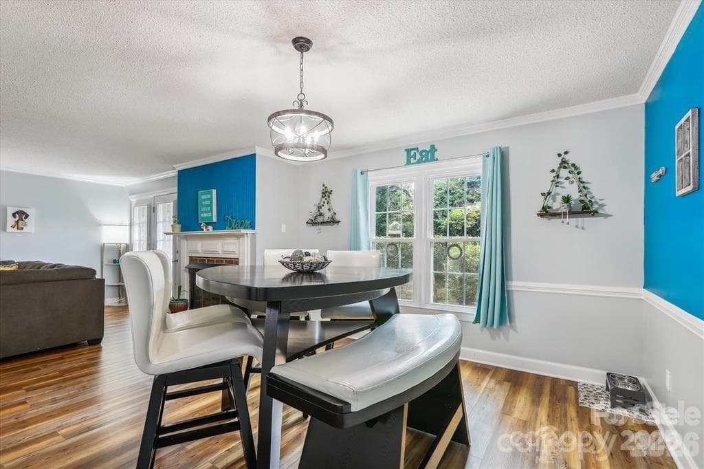Charming dedicated dining area with a cozy atmosphere, perfect for everyday meals and special gatherings alike - 806 Colony Oaks Drive, Monroe