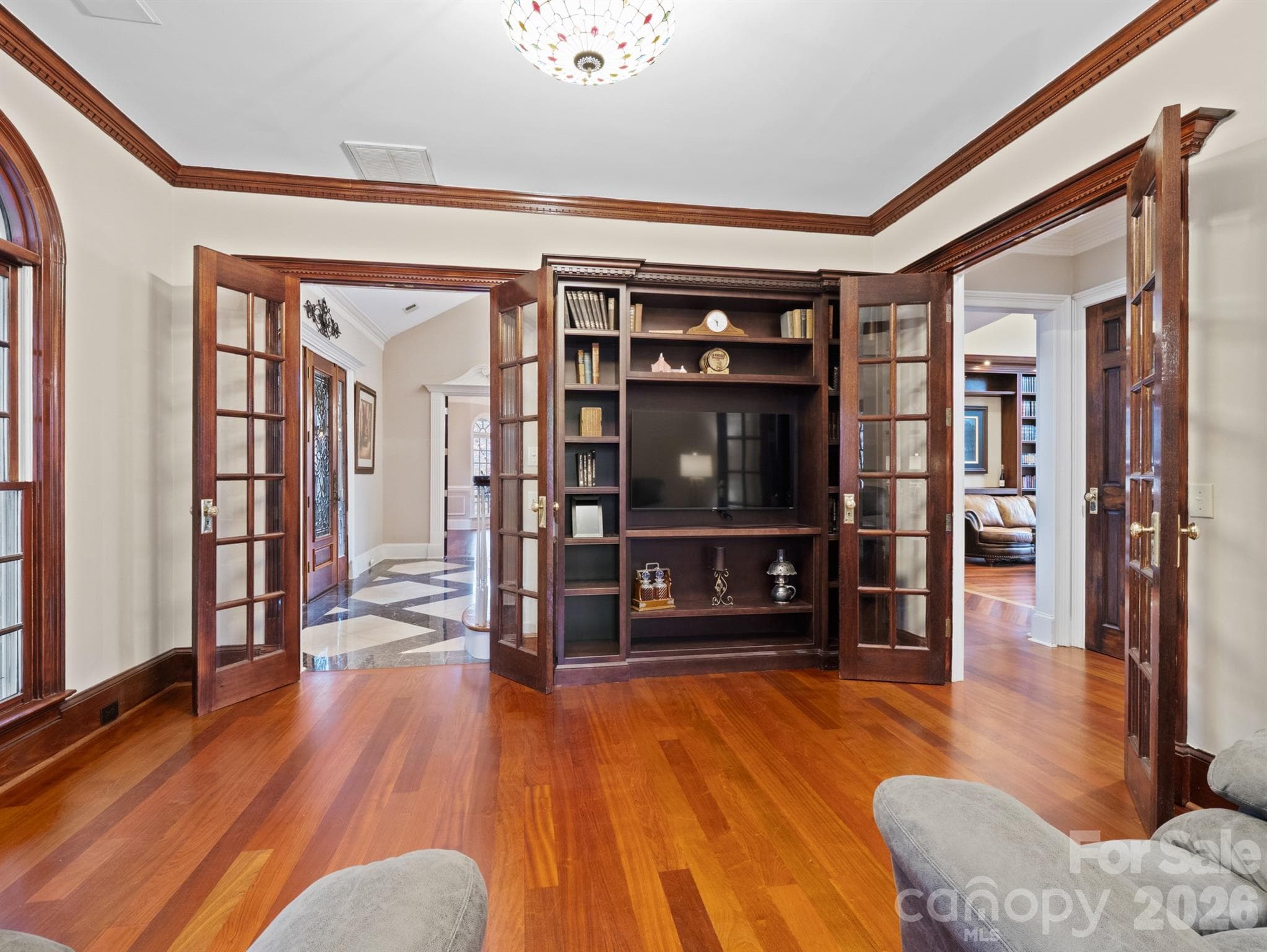 Sophisticated executive office with detailed dental crown molding and elegant double French doors. - 1090 N Saunders Drive, Catawba
