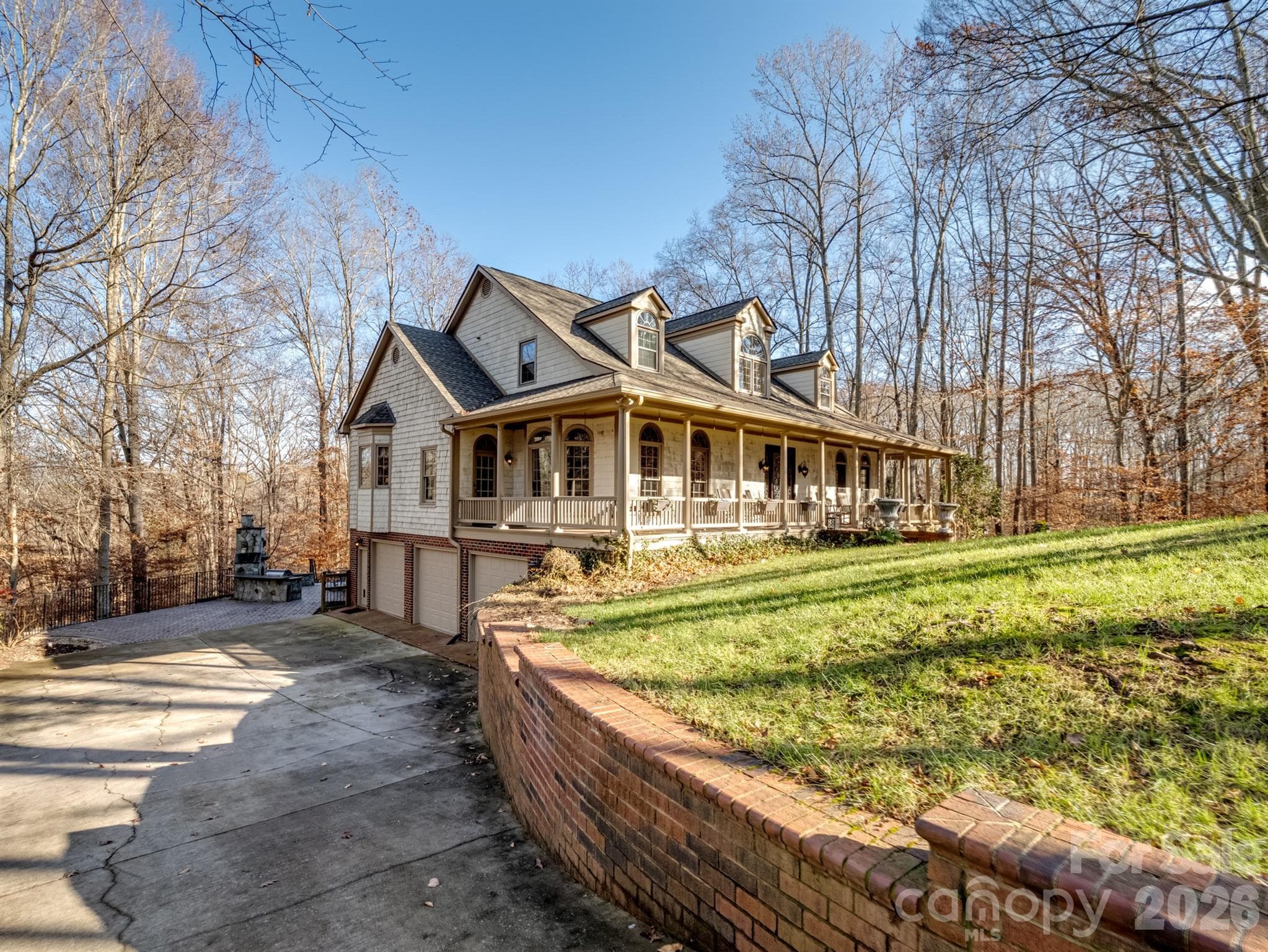 A spacious three-car attached garage accommodates all your vehicles with ease. - 1090 N Saunders Drive, Catawba