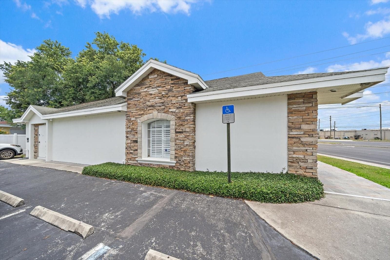 Side View with Parking - 2500 SUNSET POINT RD, CLEARWATER