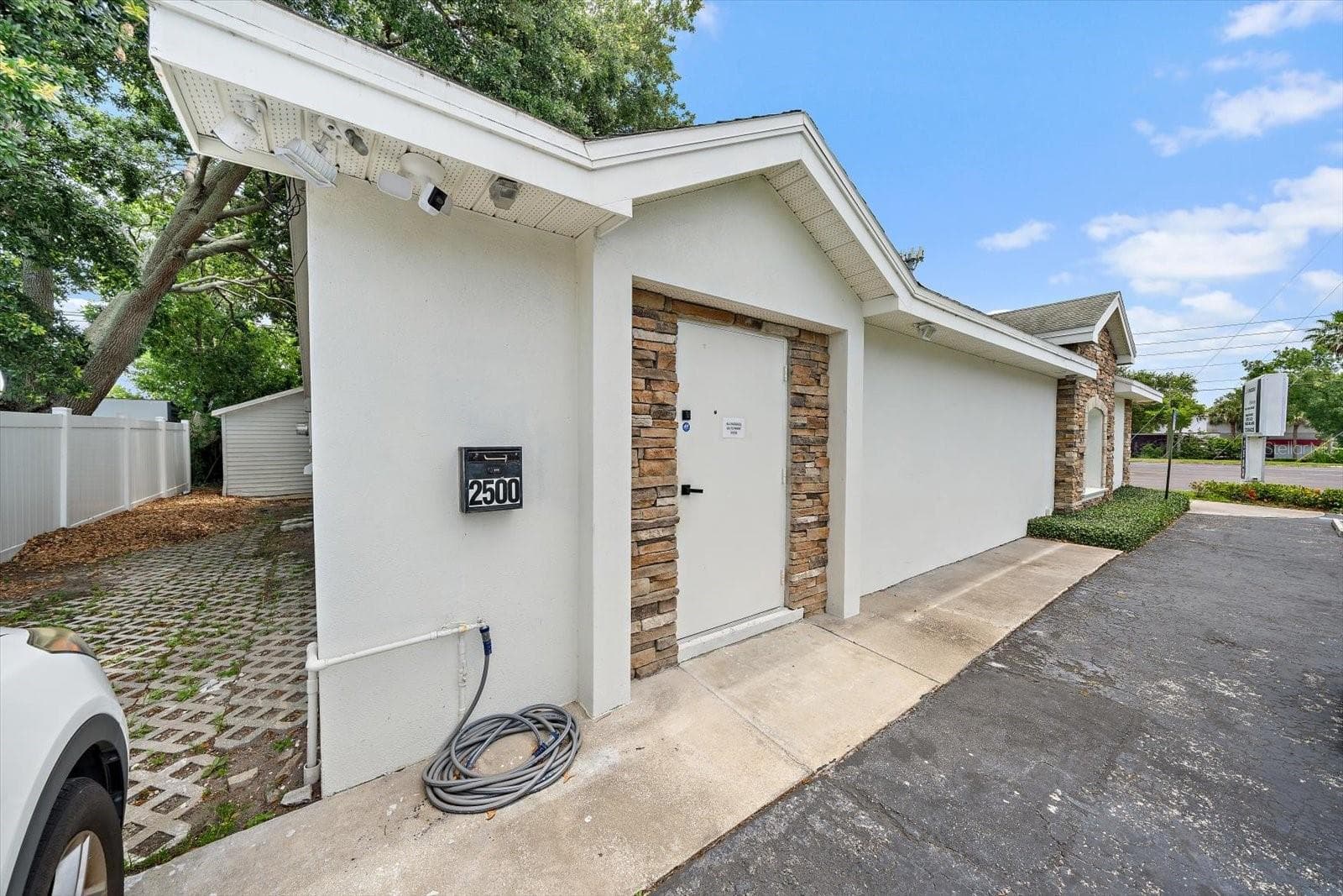 Side View with Parking - 2500 SUNSET POINT RD, CLEARWATER