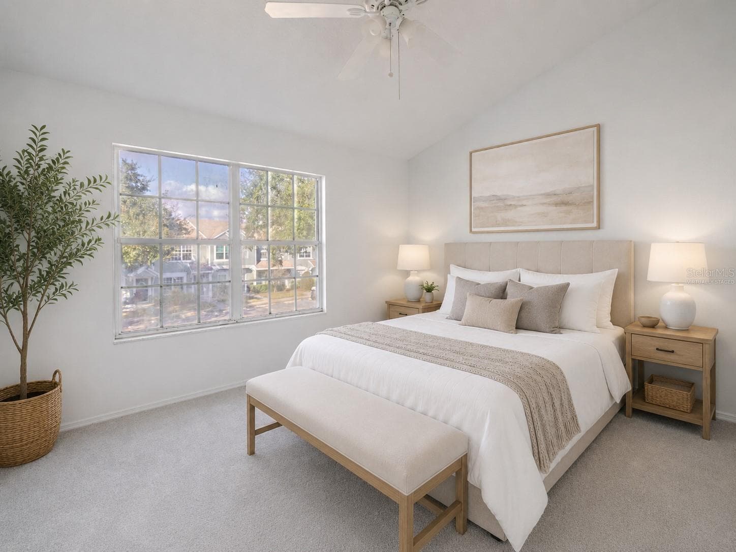 The 2nd bedroom features carpet, a ceiling fan with light kit and vaulted ceiling. (Photo has been virtually staged.) - 2432 LAKE WOODBERRY CIR, BRANDON