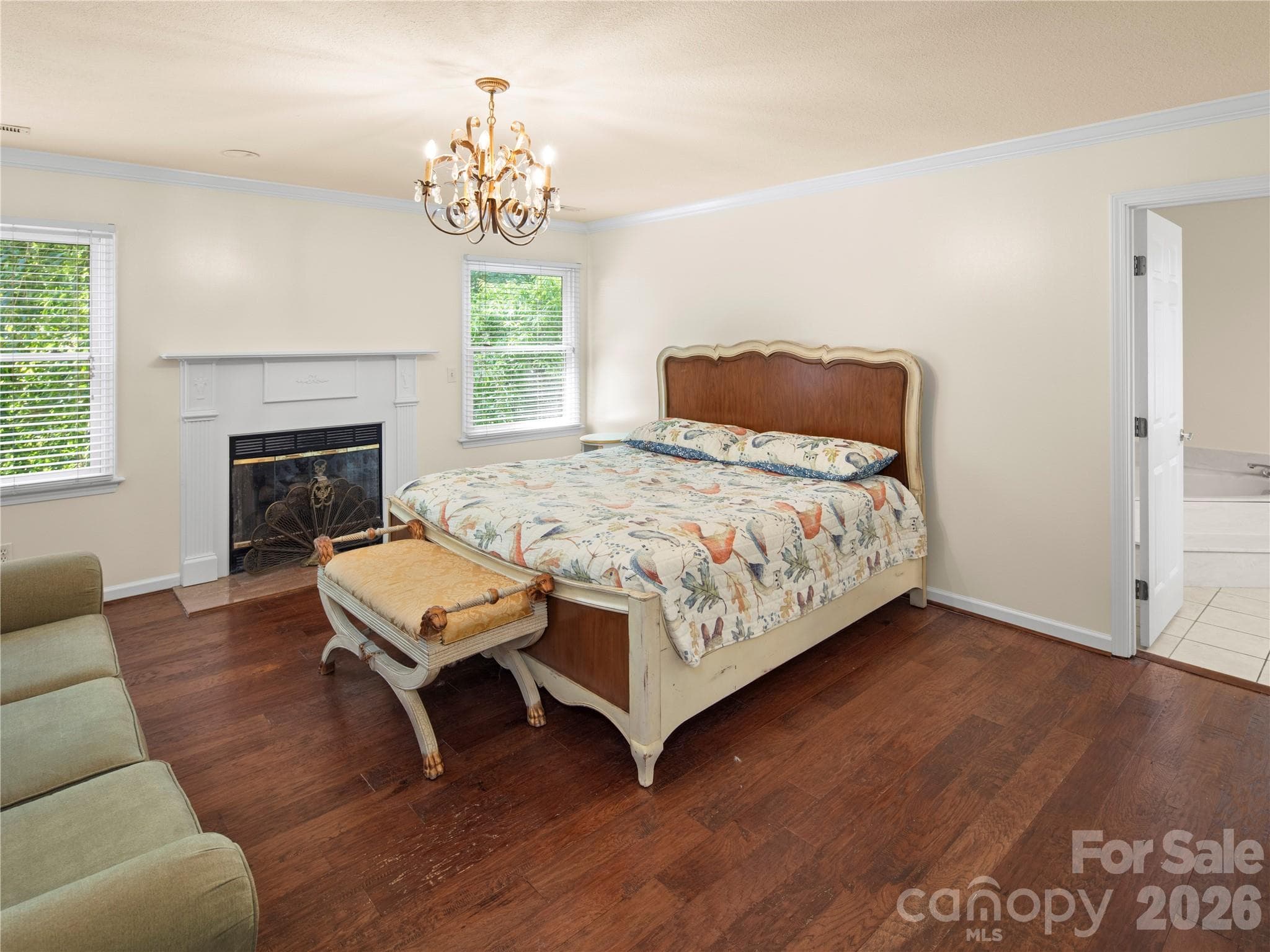 Primary bedroom is spacious with a gas fireplace - 105 Braeside Circle, Asheville
