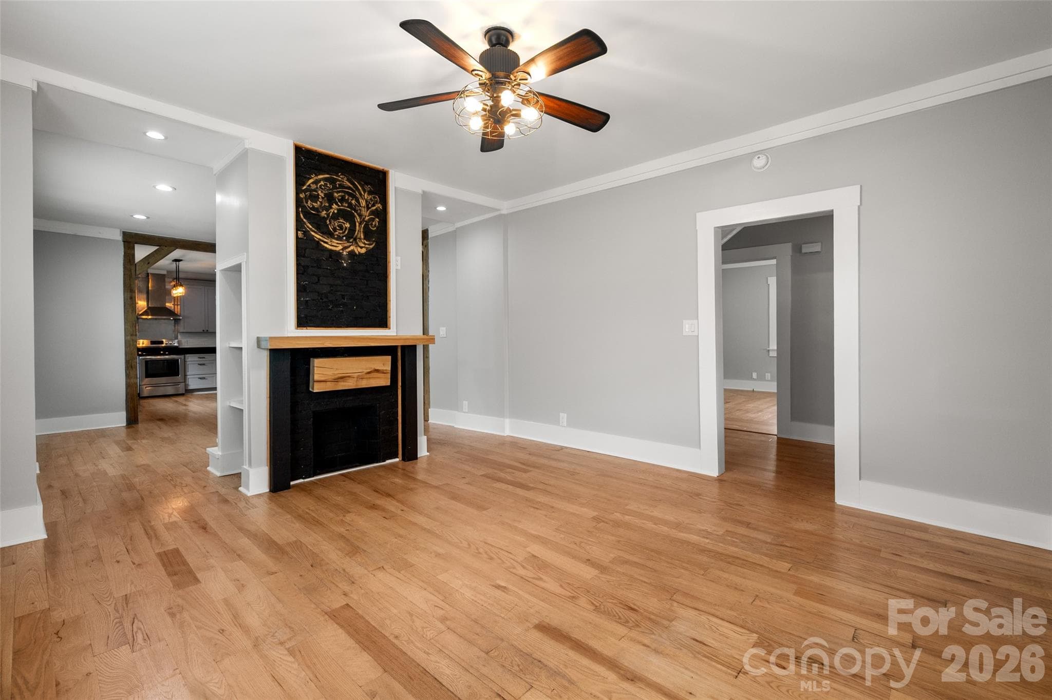 Double sided fireplace in the living room - 174 Tournament Drive SW, Concord