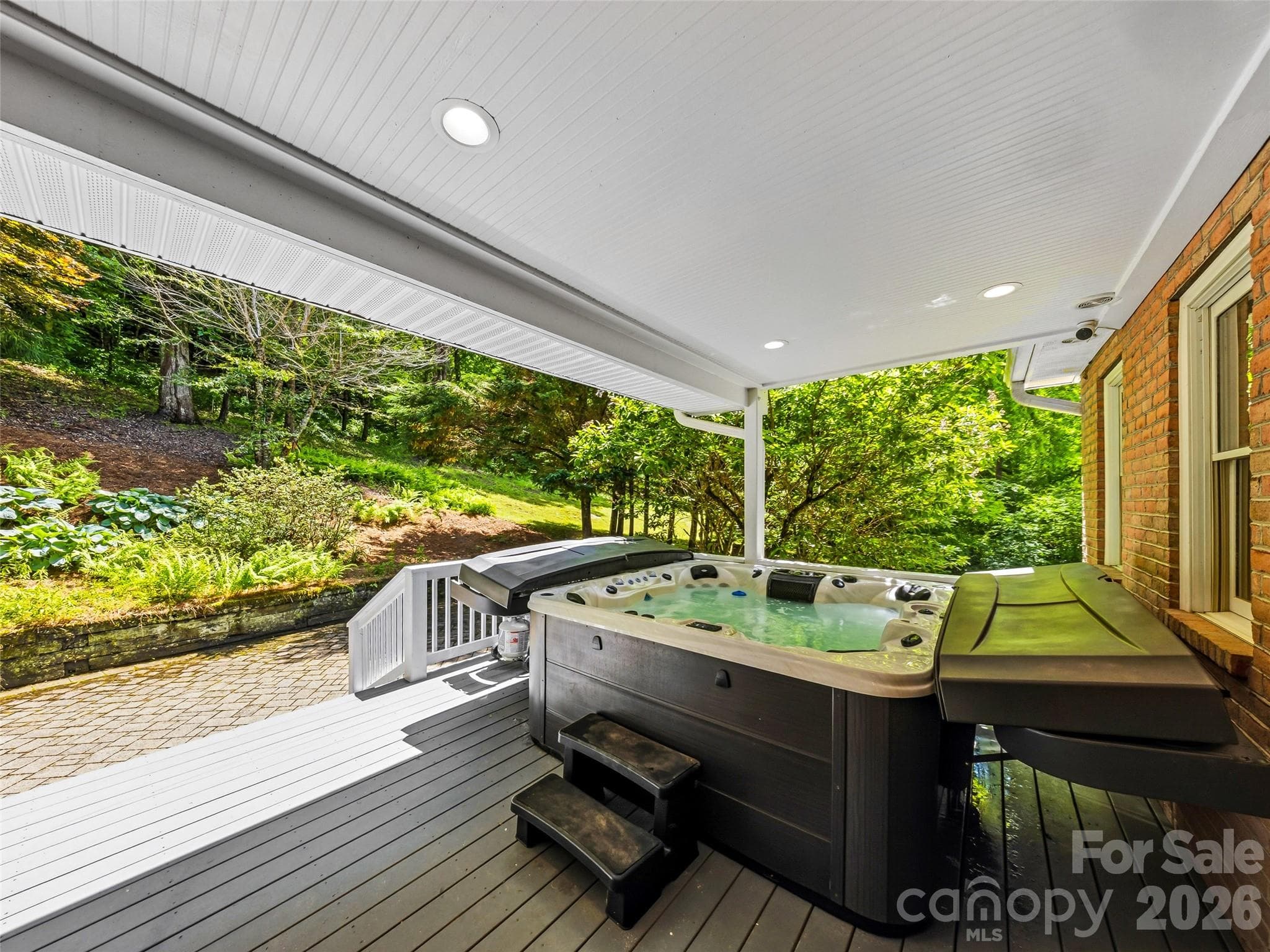 like new hot tub conveys deck built specifically for this use - 243 Poplar Lane, Pisgah Forest