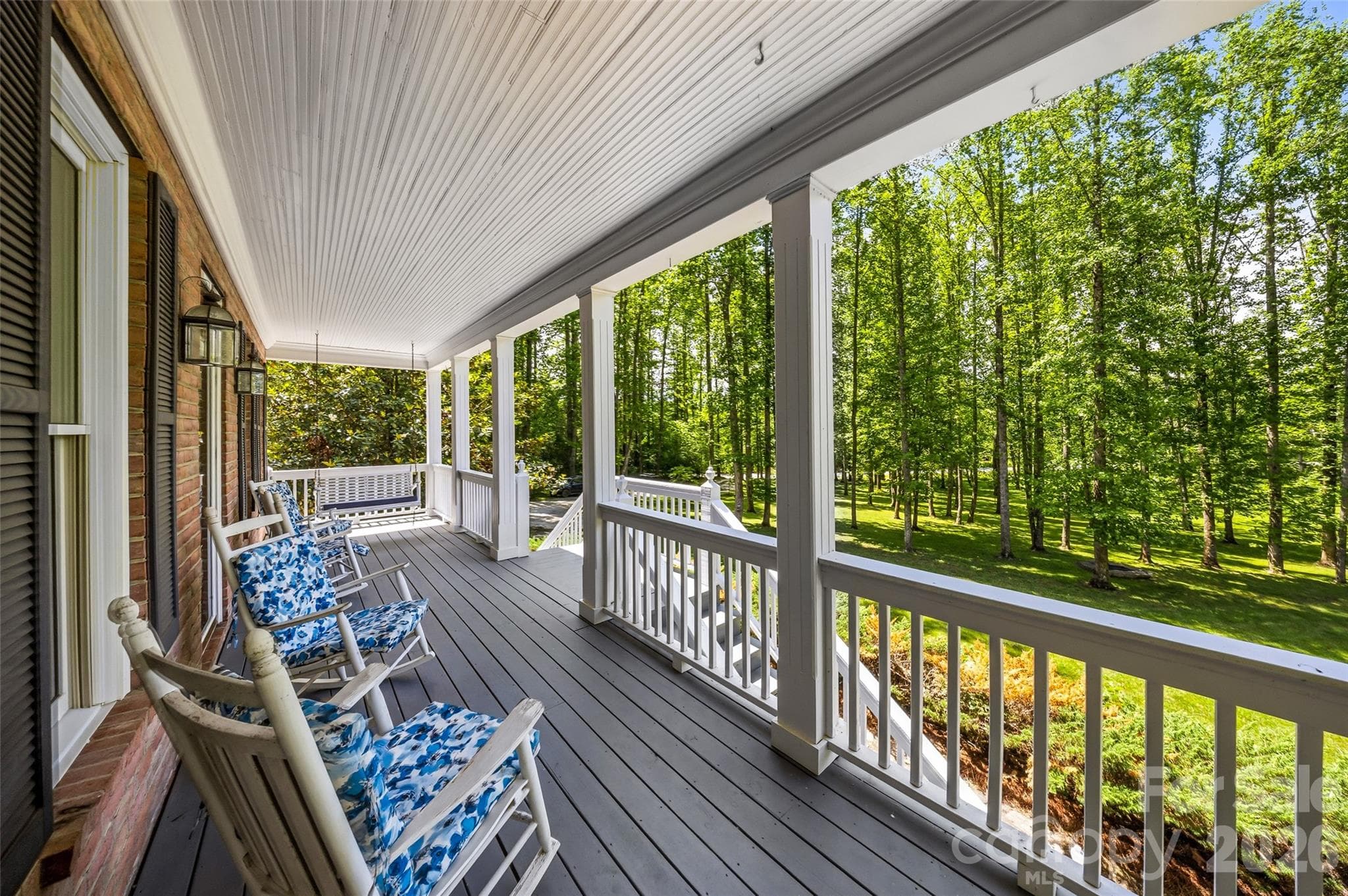 Main level front porch over looks fire pit and grounds - 243 Poplar Lane, Pisgah Forest