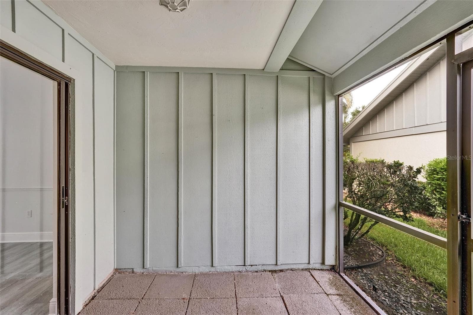 Screened patio off the kitchen and dinning area - 7861 PINE TRACE DR #7861, SARASOTA