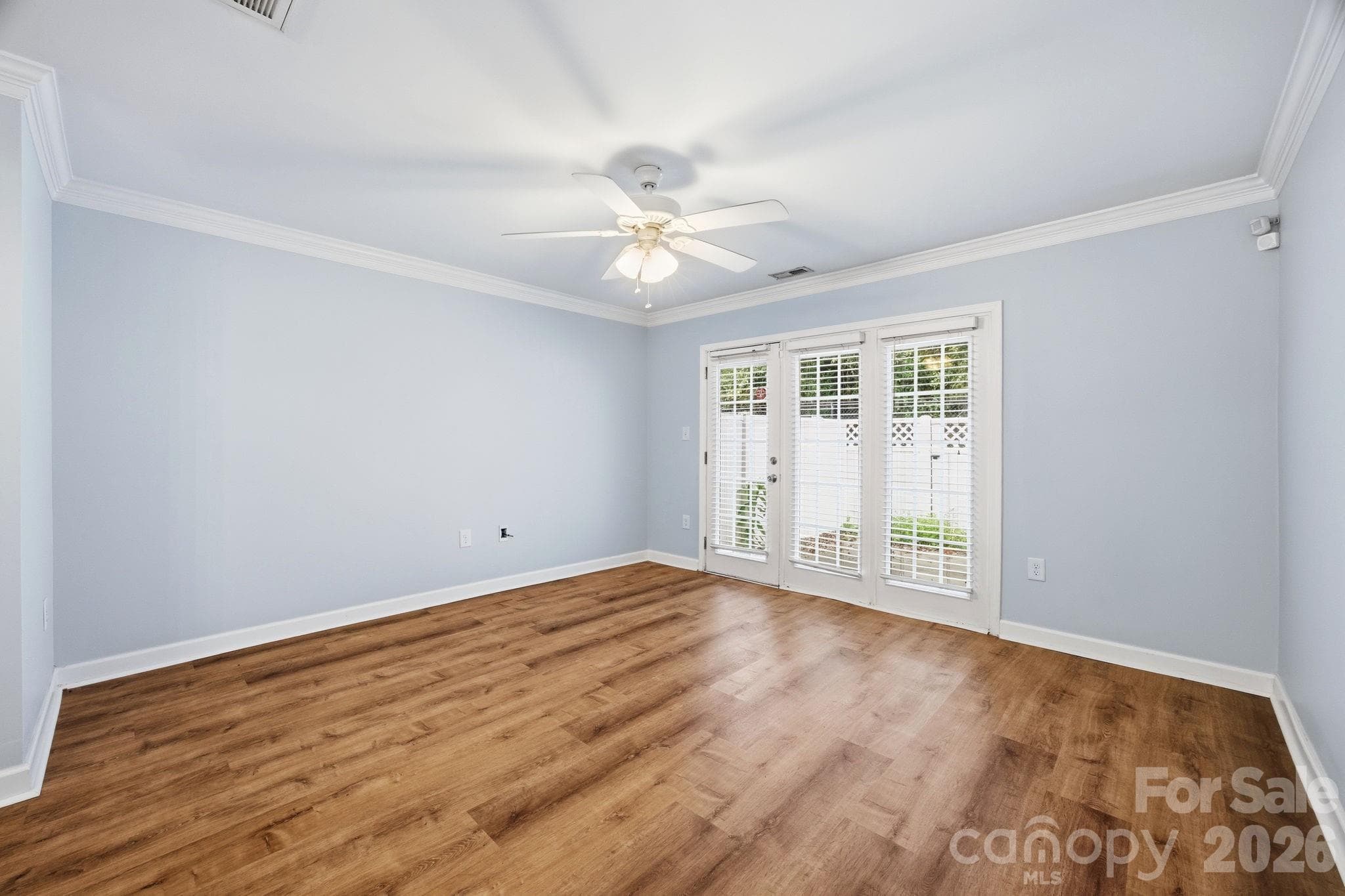 Living room w/ wall of natural light to rear patio - 1215 Green Oaks Lane, Charlotte