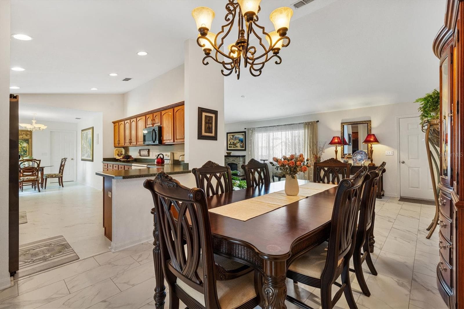 Dining room with kitchen to left - 9498 SE 174TH LOOP, SUMMERFIELD