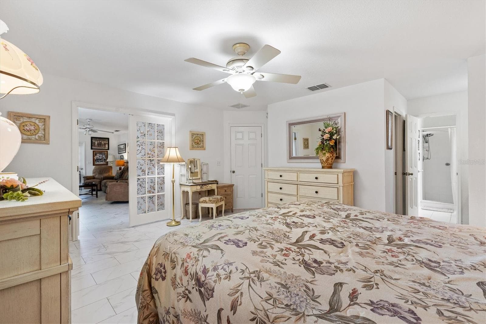 Another angle of Primary bedroom with French doors that open to Florida room - 9498 SE 174TH LOOP, SUMMERFIELD